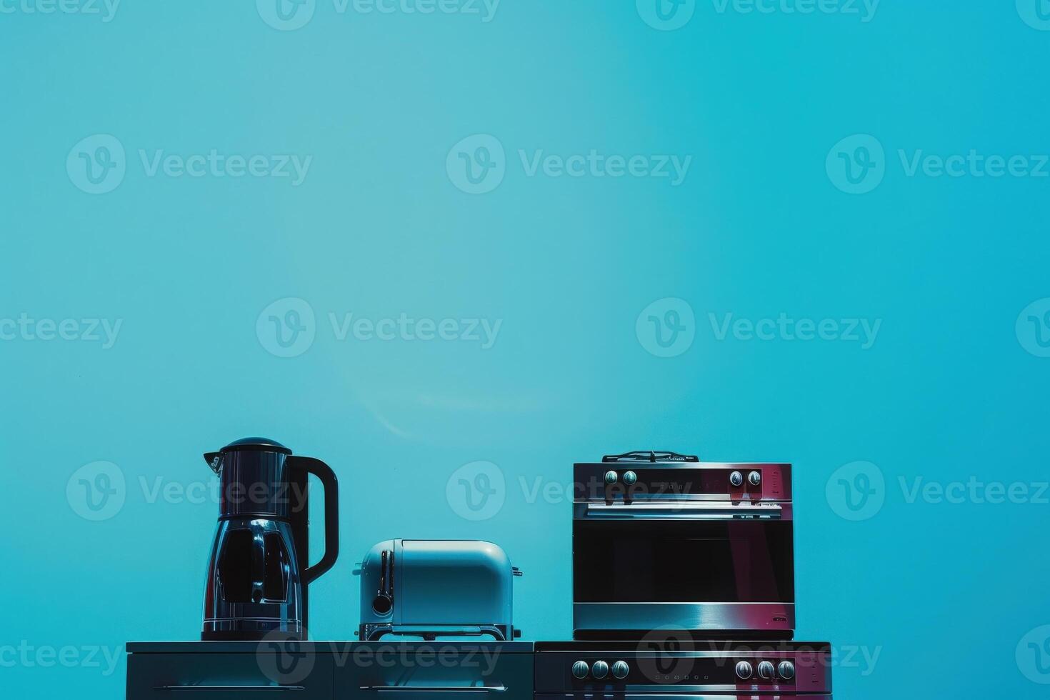 A modern setup showcases a kettle, toaster, and oven, exuding elegance and sustainability in a vivid blue setting. photo
