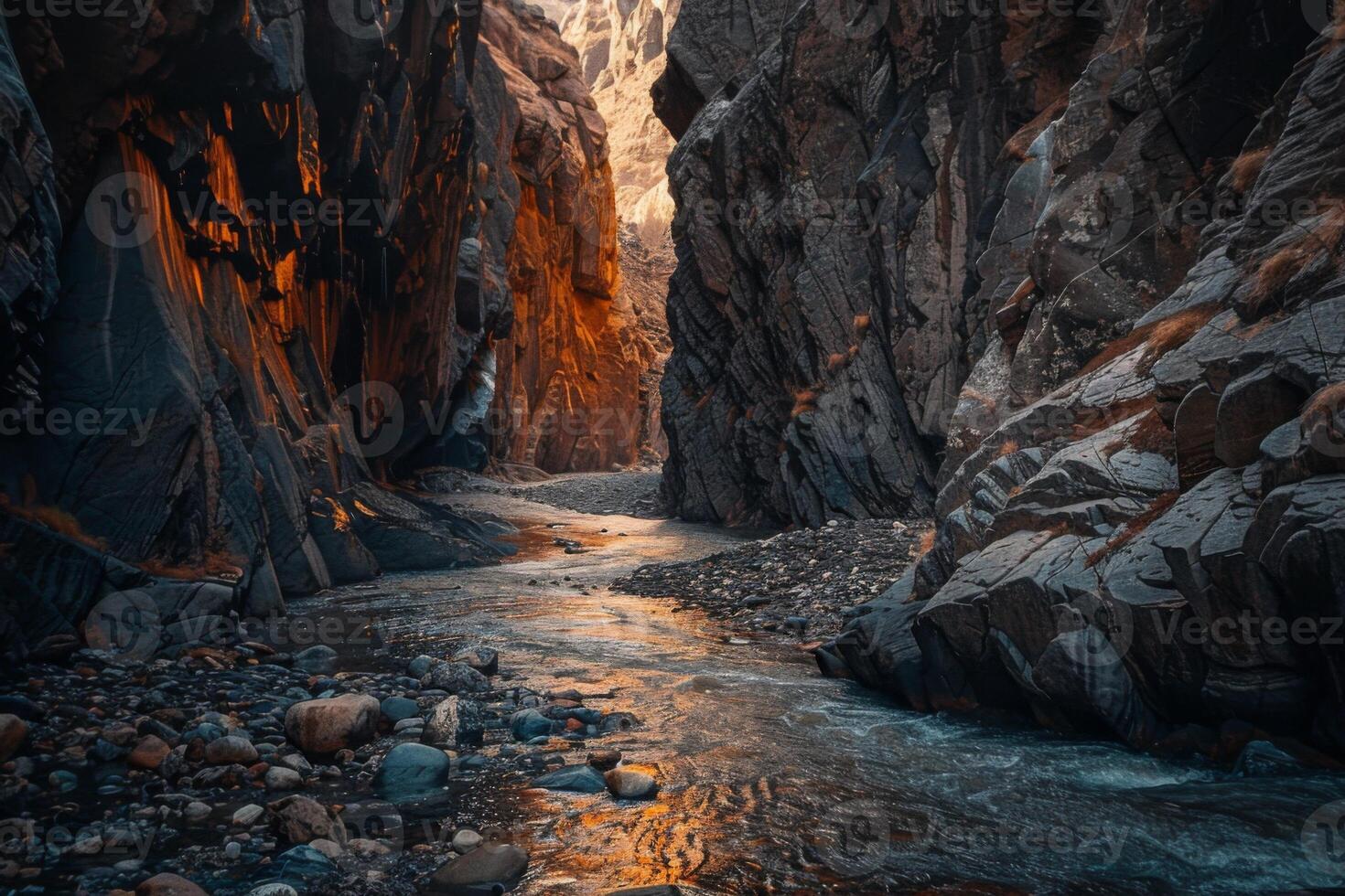 A river runs through a canyon with a rocky shoreline photo