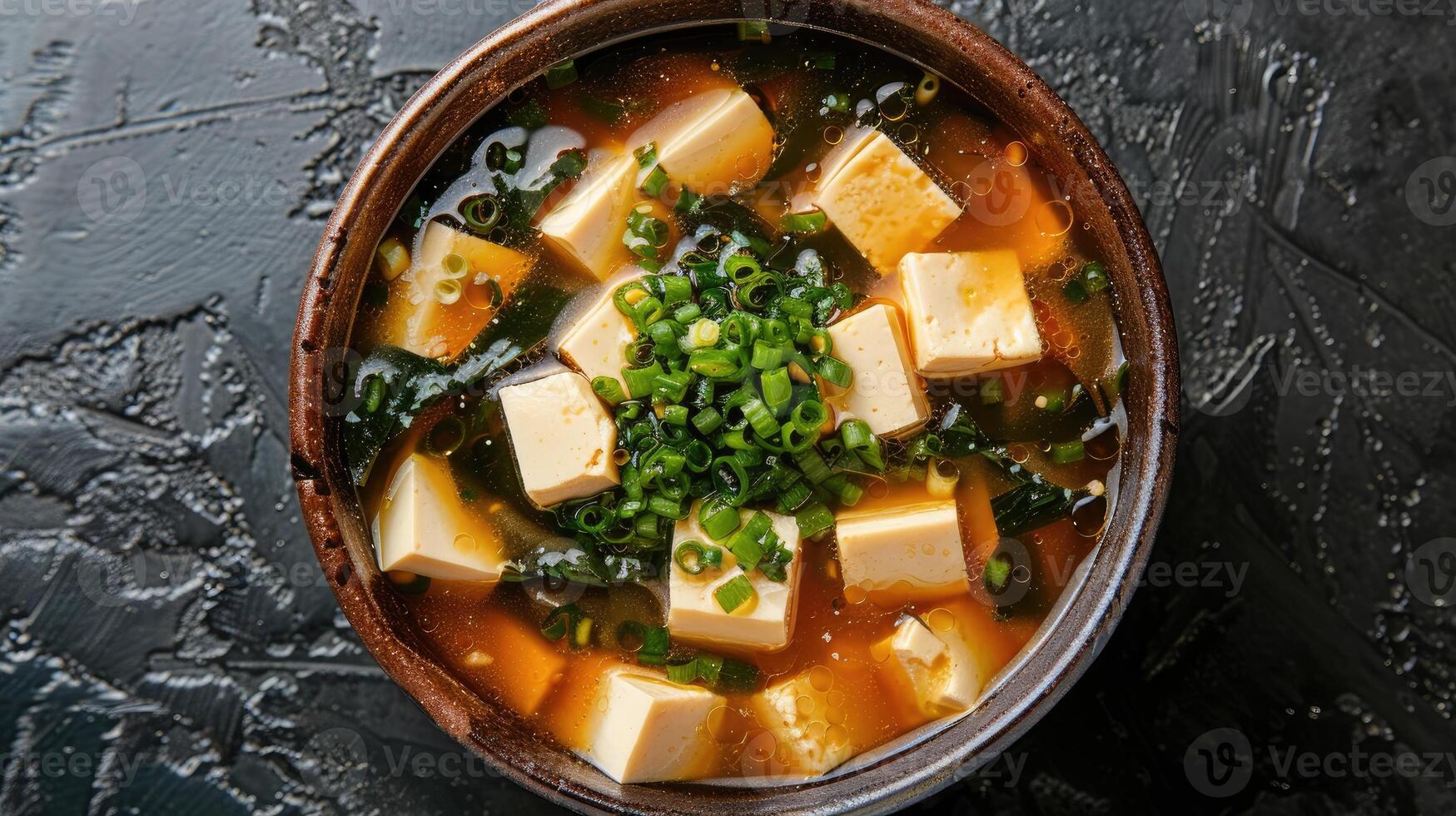 Bowl of Japanese Miso Soup with Tofu and Seaweed photo
