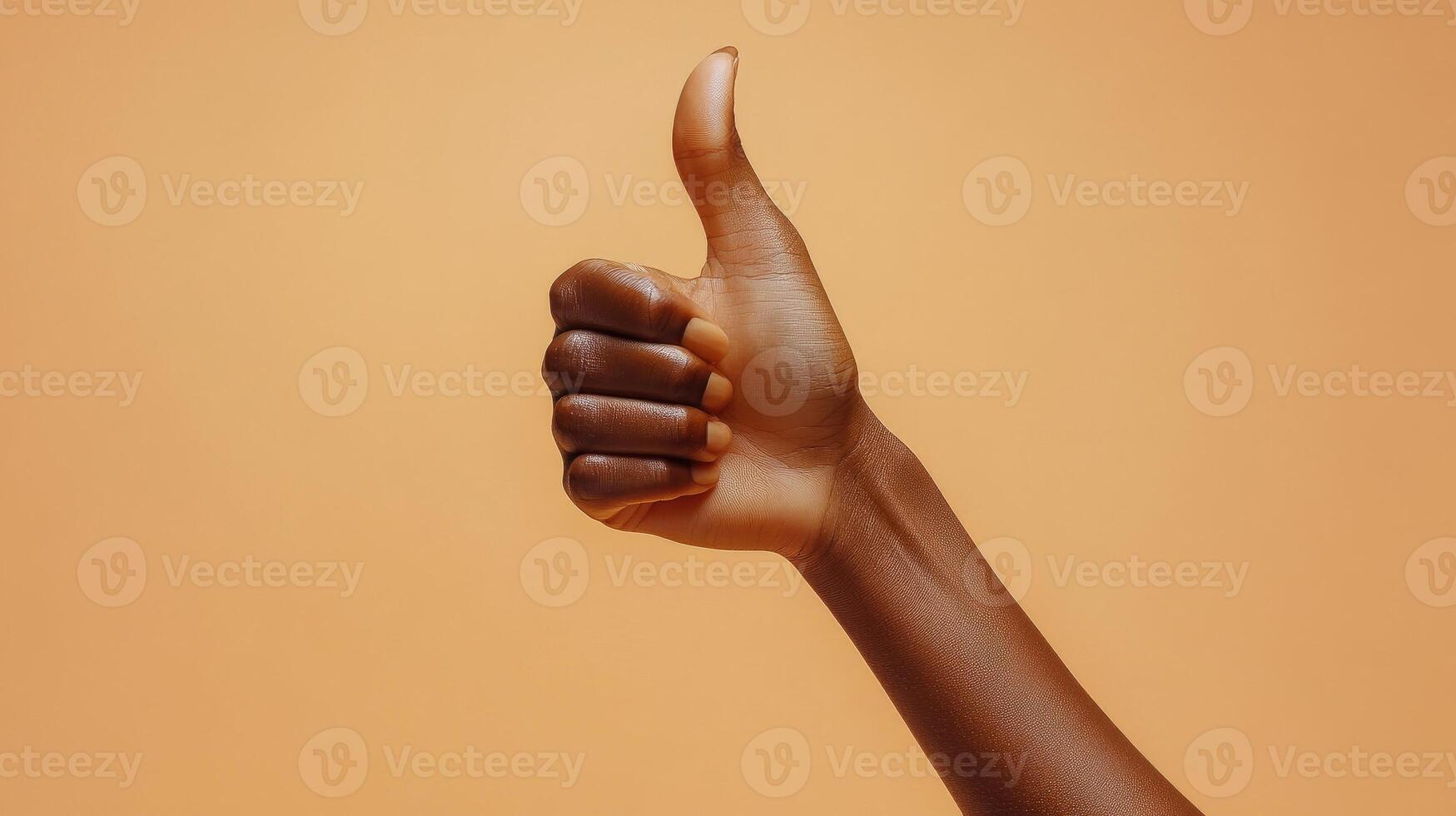 A Hand Giving a Thumbs Up Gesture photo