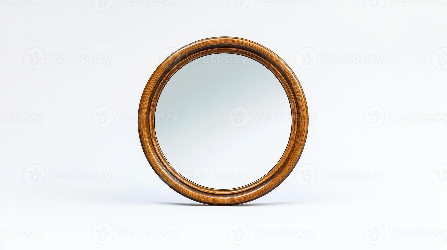 A round wooden mirror with a simple design against a plain white background photo
