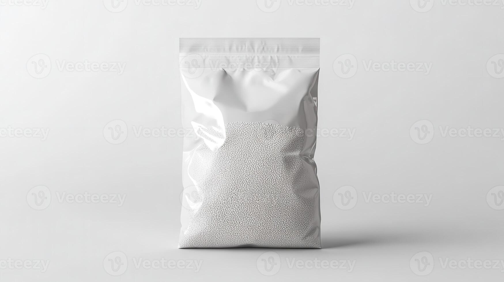 Clear plastic bag filled with small white beads on a plain background photo