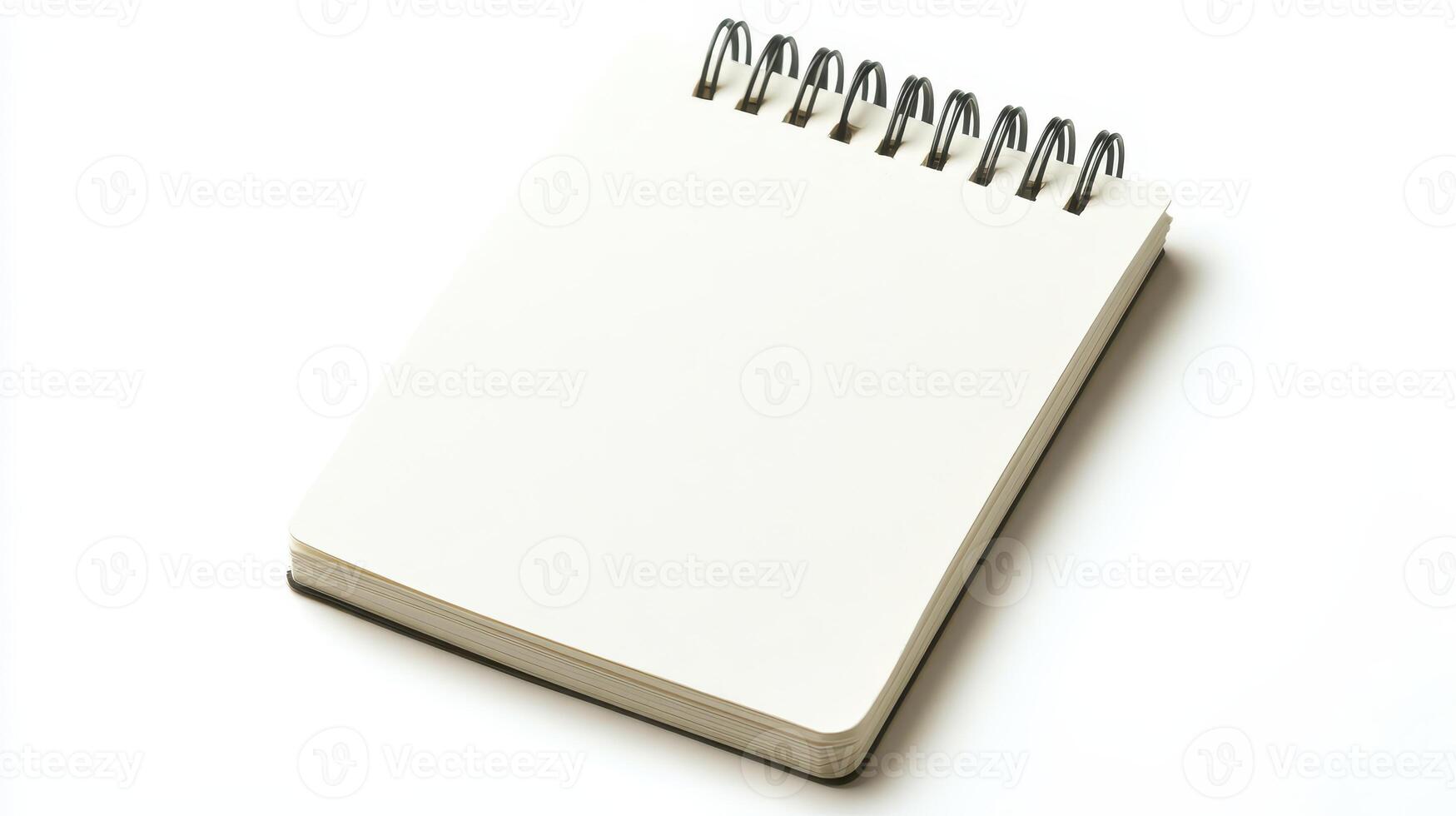 Blank spiral notebook resting on a flat surface, ready for notes, sketches, or creative writing photo