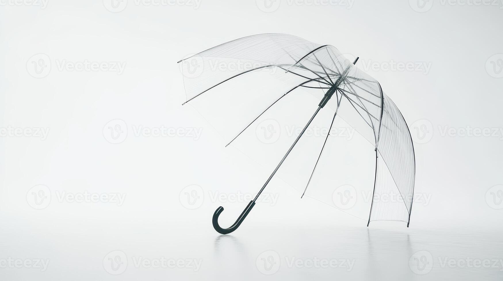 Transparent umbrella leaning on a smooth surface against a light background in a minimalist setting photo