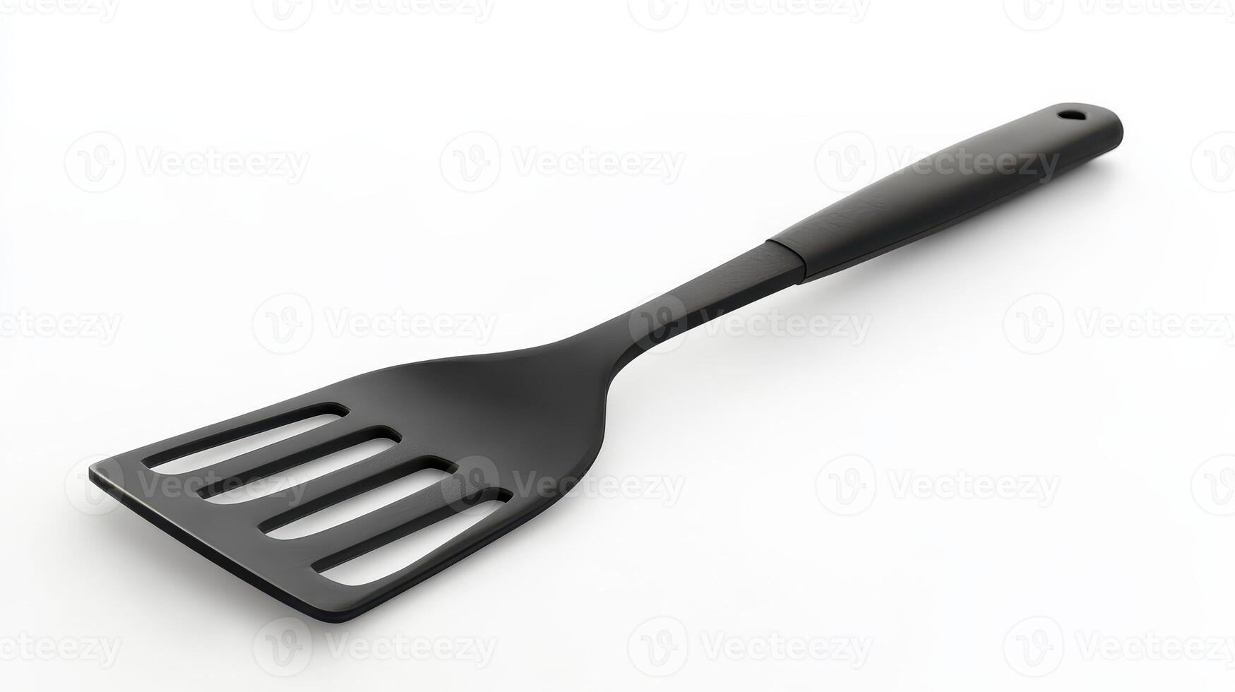 Black spatula on a white background ready for cooking and baking photo