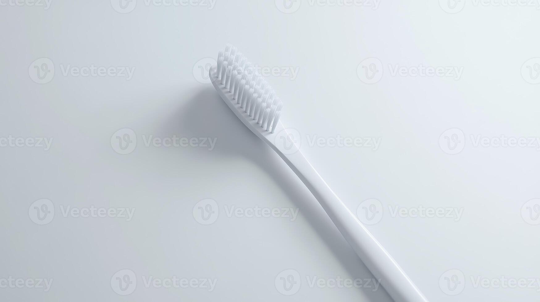 A close-up view of a white toothbrush on a clean, minimalistic surface photo