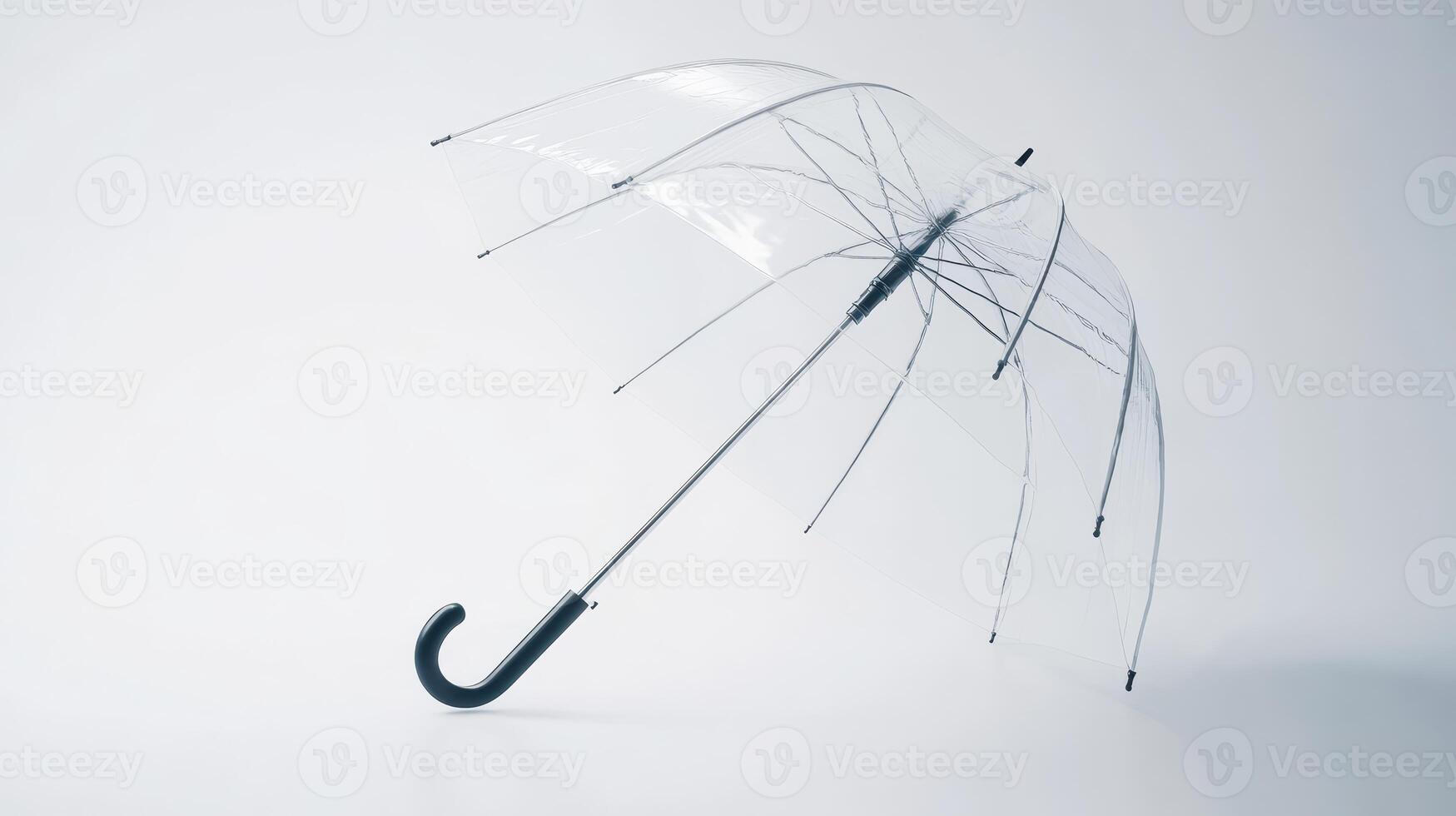 A clear umbrella stands upright on a plain surface with a minimalist background photo