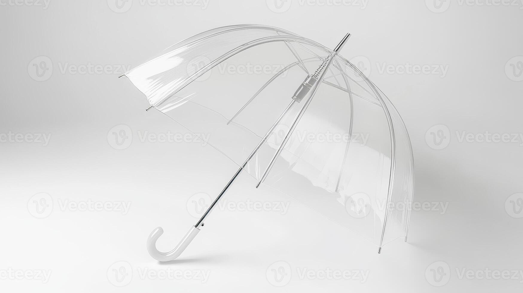 A clear umbrella with a curved handle positioned against a plain white background photo