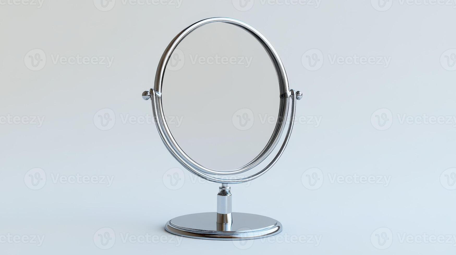 Simple chrome makeup mirror on a plain background photo