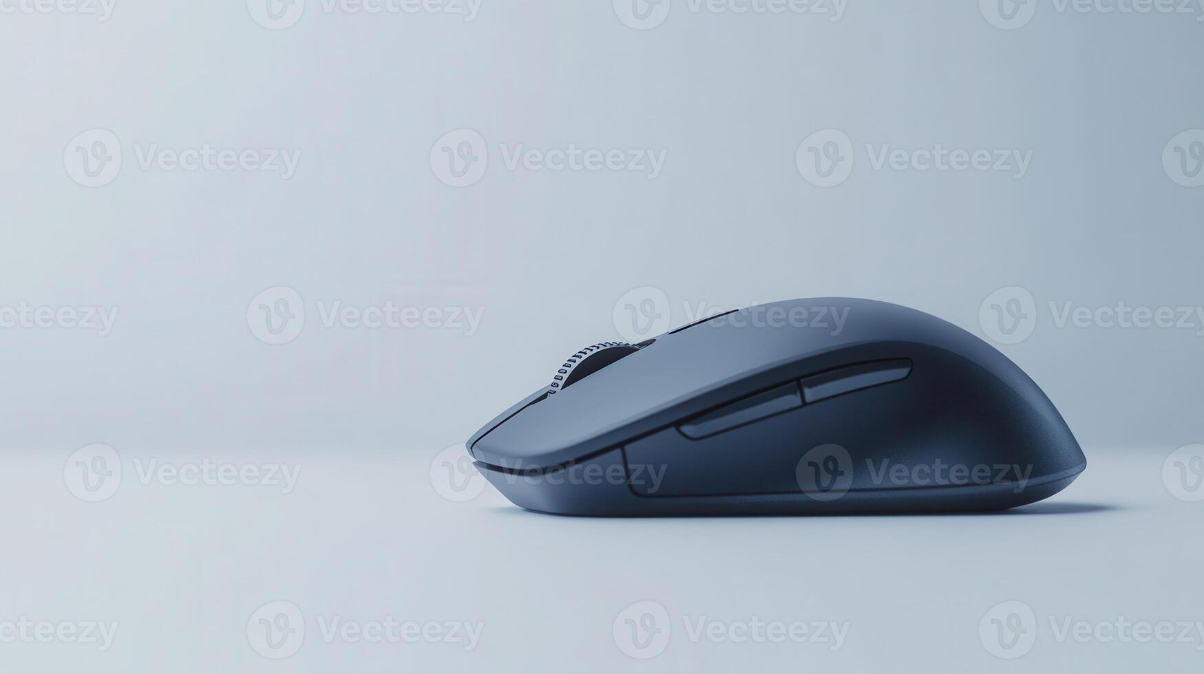 A close-up of a sleek wireless computer mouse resting on a minimalistic desk against a soft gray backdrop photo