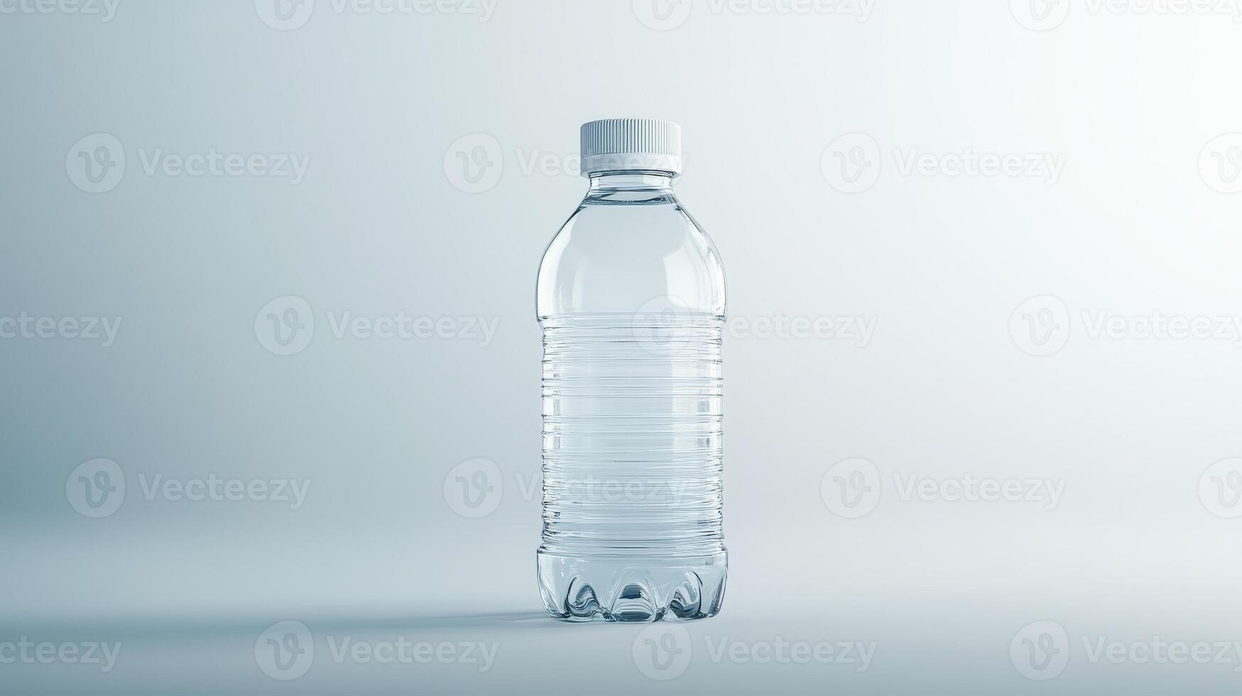 Clear plastic water bottle standing upright against a light background in a minimalist setting photo