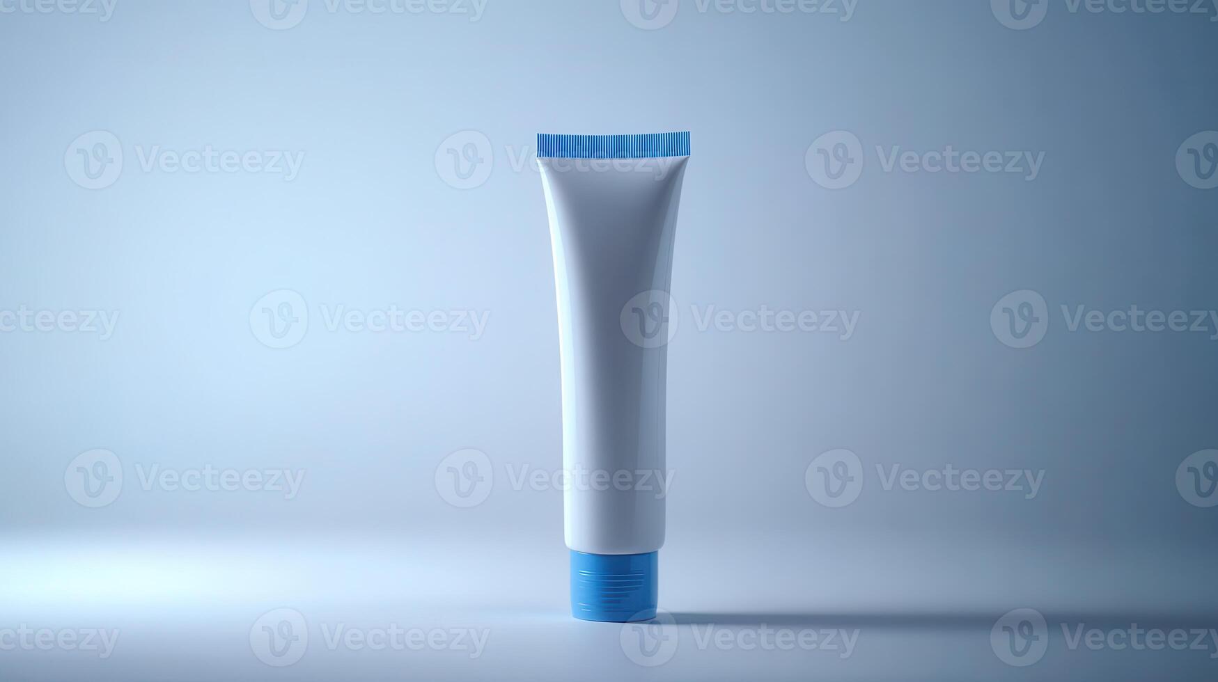 A white cosmetic tube with a blue cap displayed against a soft blue background in a minimalist setting photo