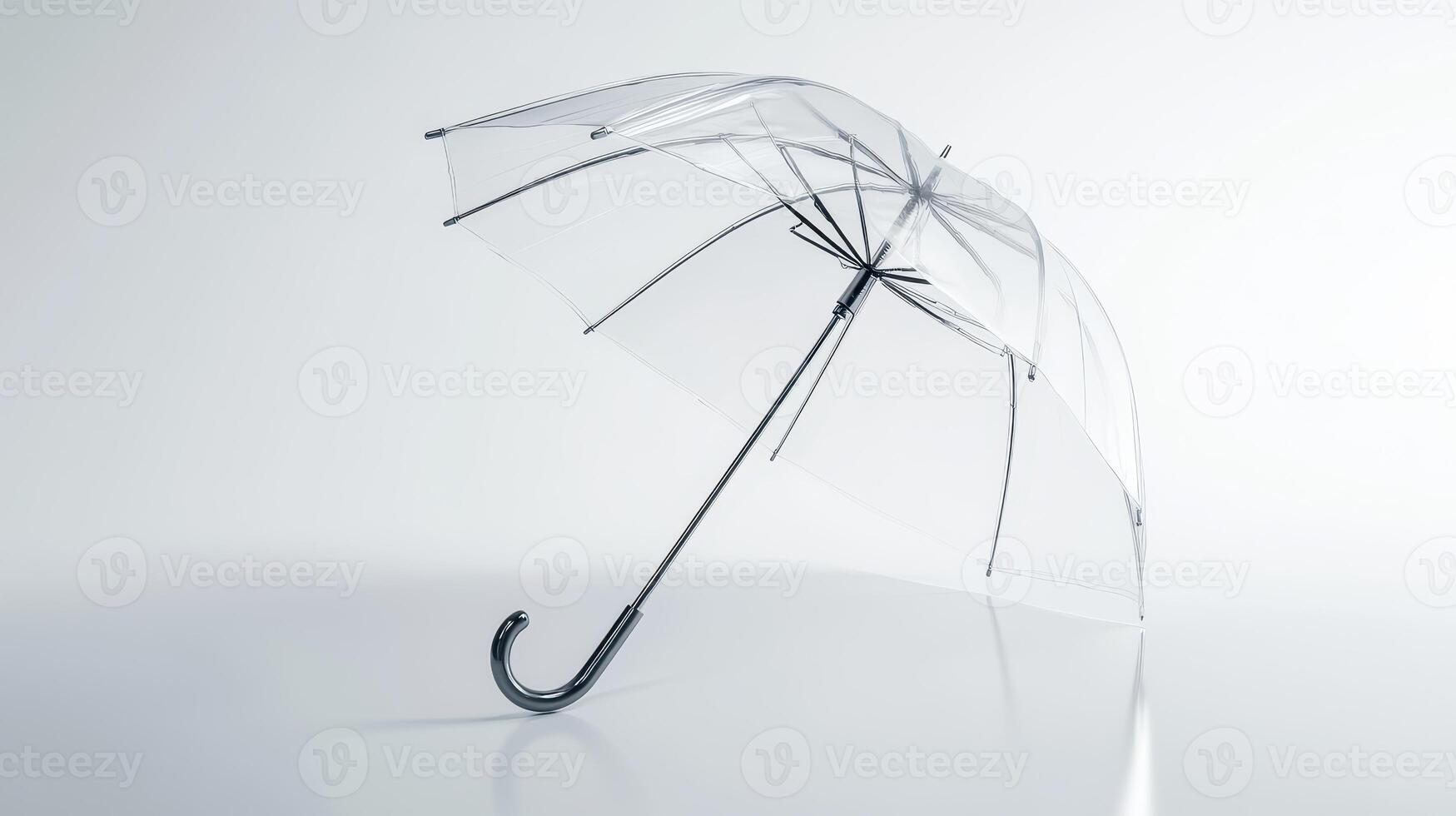 A clear umbrella stands upright on a smooth surface with a minimalist background, showcasing its design and structure in natural light photo