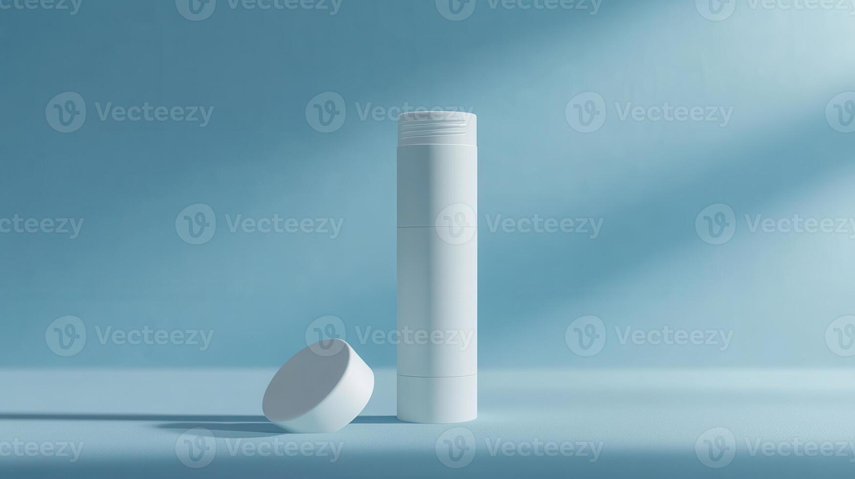 Minimalist cylindrical container with lid on a light blue background during bright daylight photo