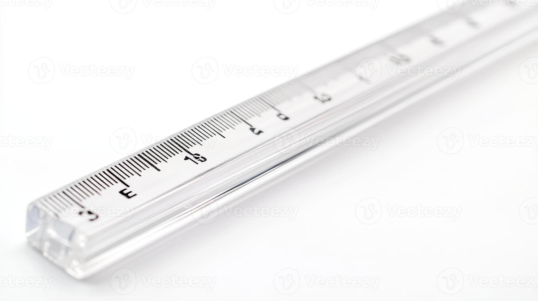 Clear acrylic ruler measuring up to 30 centimeters positioned on a white surface photo