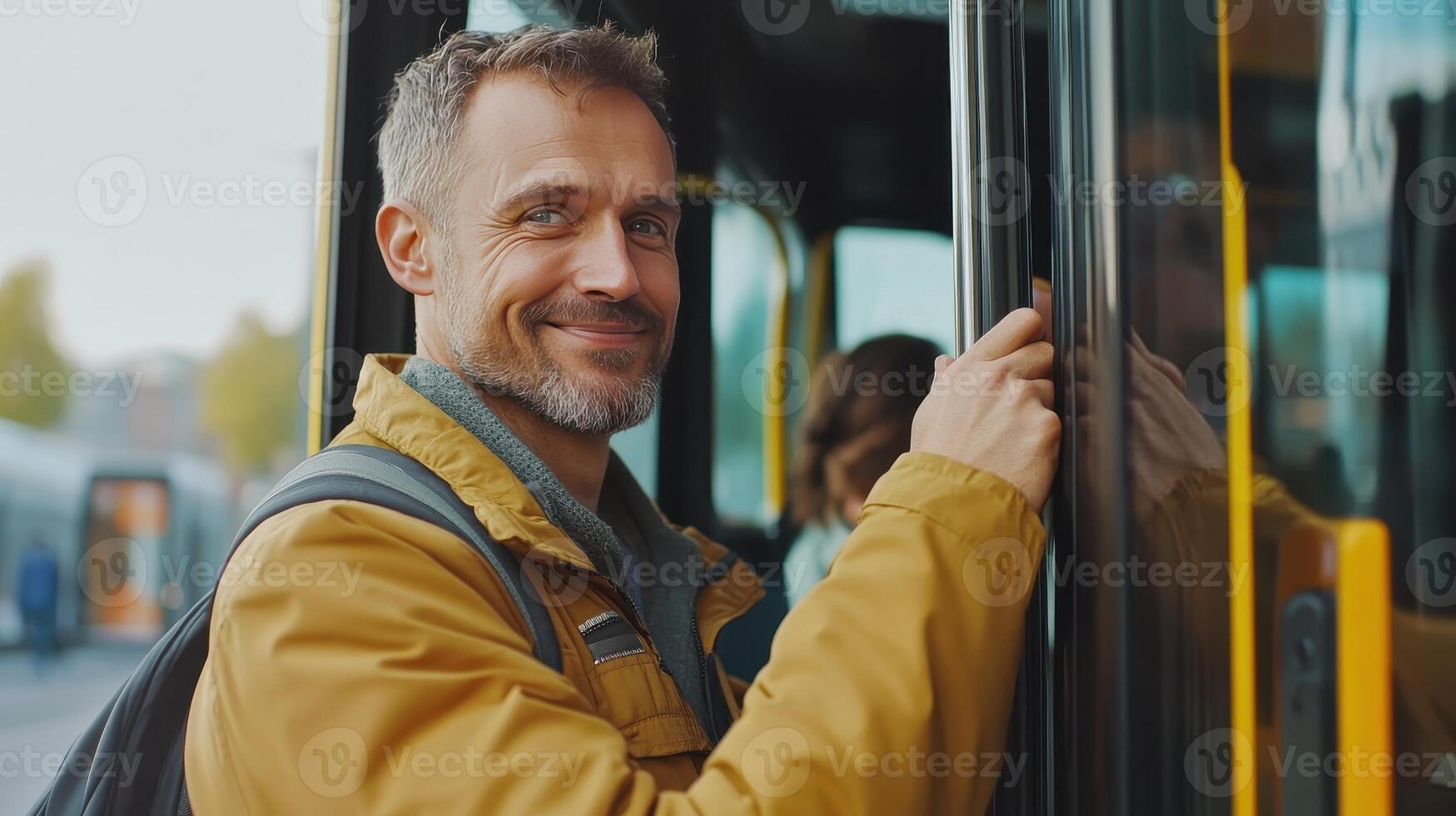 Man Standing By Bus Door Smiling While Waiting to Board in Urban Environment During Daytime photo