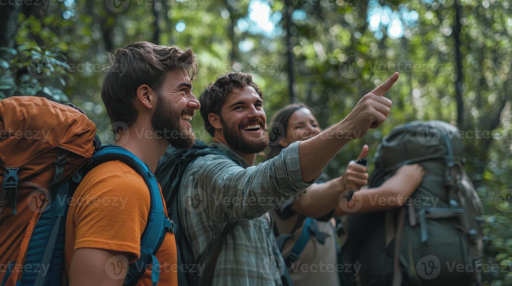 Group of Friends Hiking Through Lush Forest Smiling and Pointing at Scenic View in Bright Daylight photo