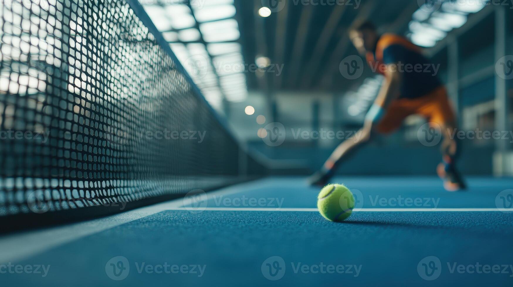 Athlete Preparing to Hit a Tennis Ball on a Blue Indoor Court During Daytime Training Session photo