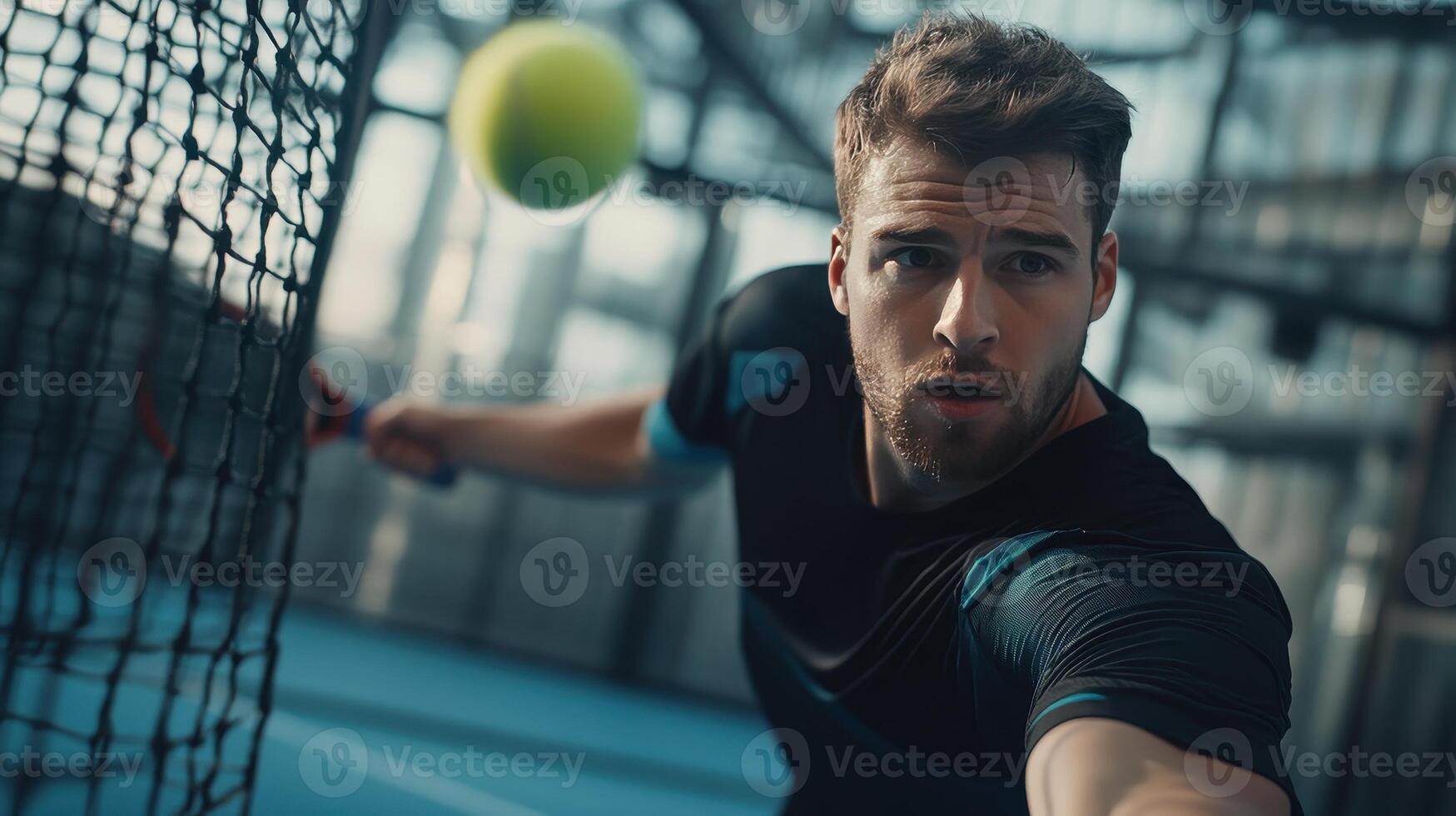 Dynamic Tennis Player Focused on Hitting a Powerful Forehand During Indoor Match at Modern Sports Facility photo