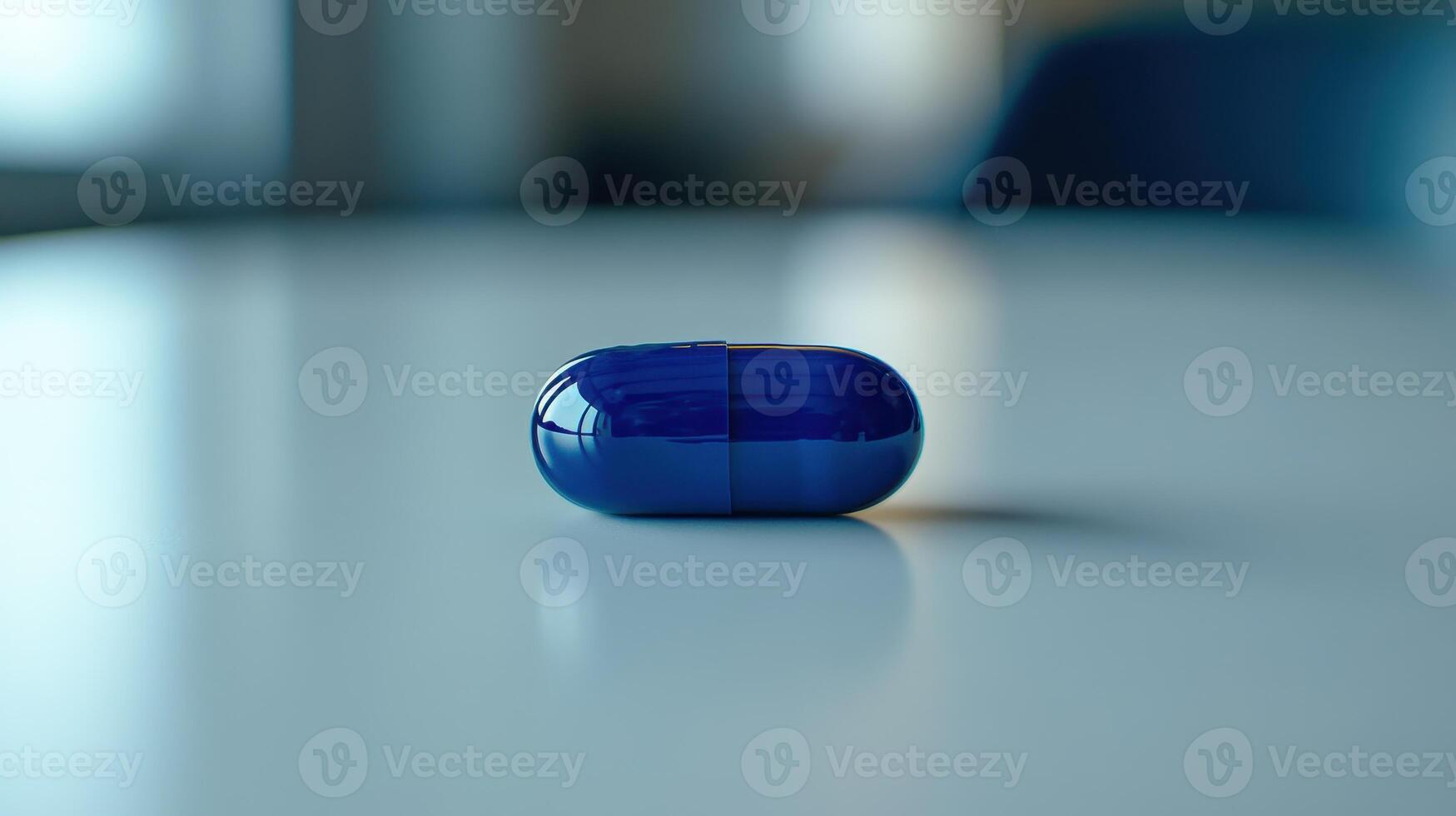 Blue Capsule Resting on a Smooth Table Surface in a Modern Office Environment During Daylight Hours photo