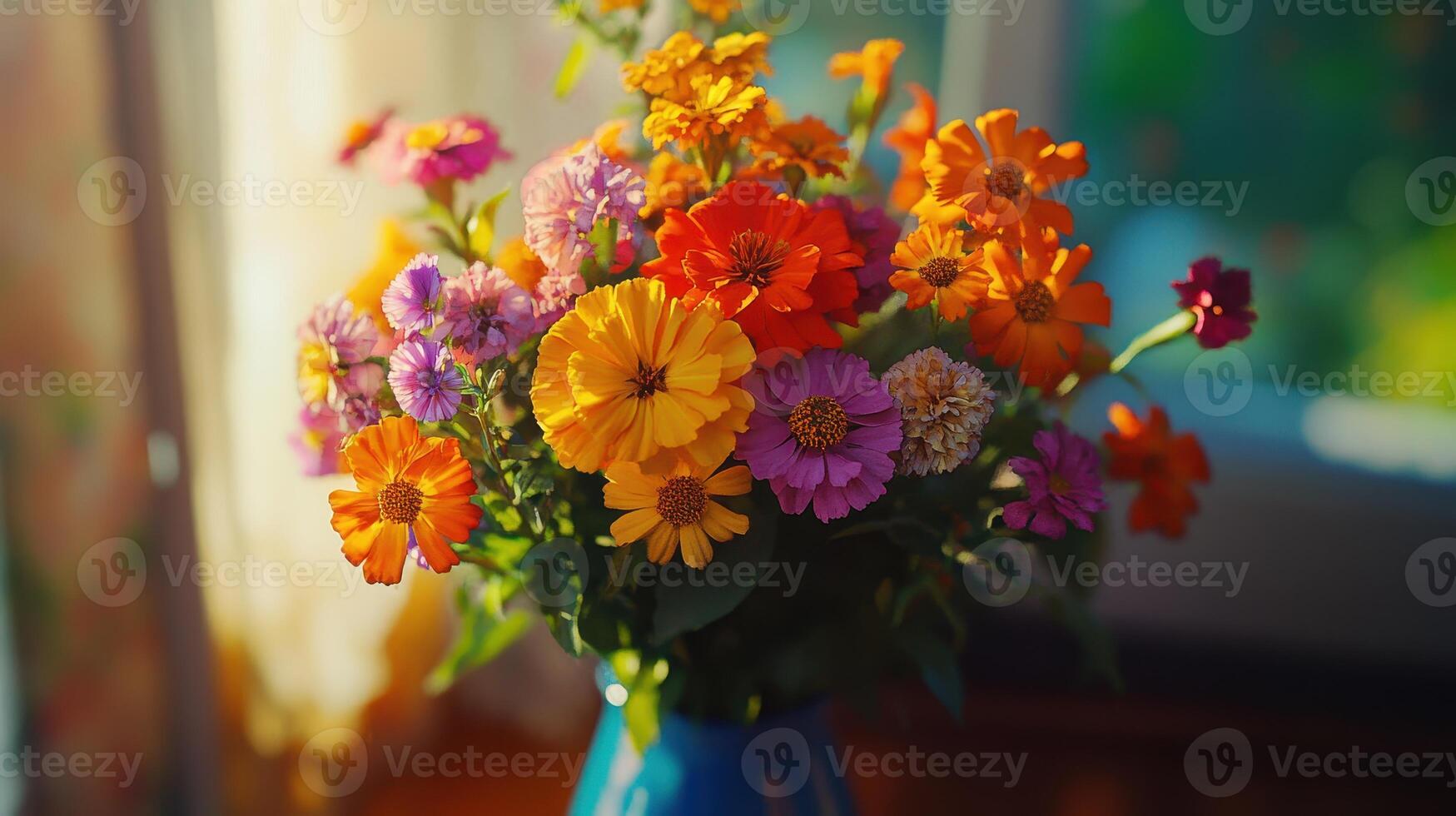 Vibrant Mixed Flower Bouquet Displayed in a Blue Vase on a Sunlit Windowsill photo