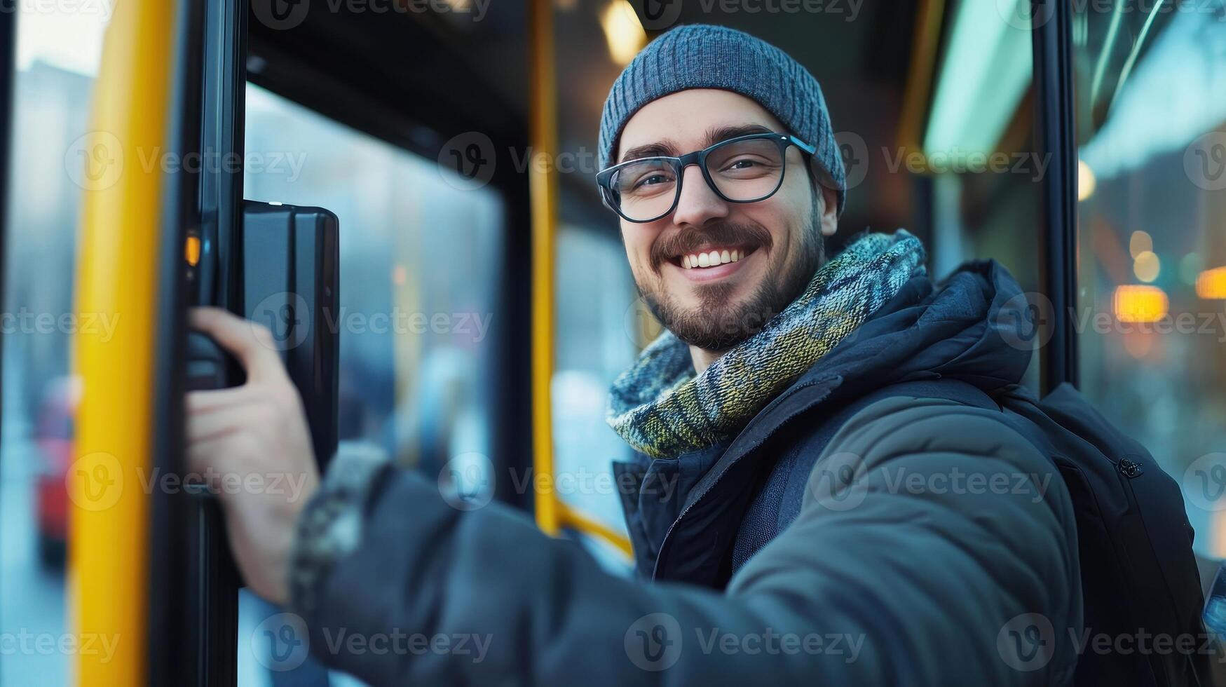 Young Man Smiling While Boarding a City Bus on a Cold Winter Morning photo