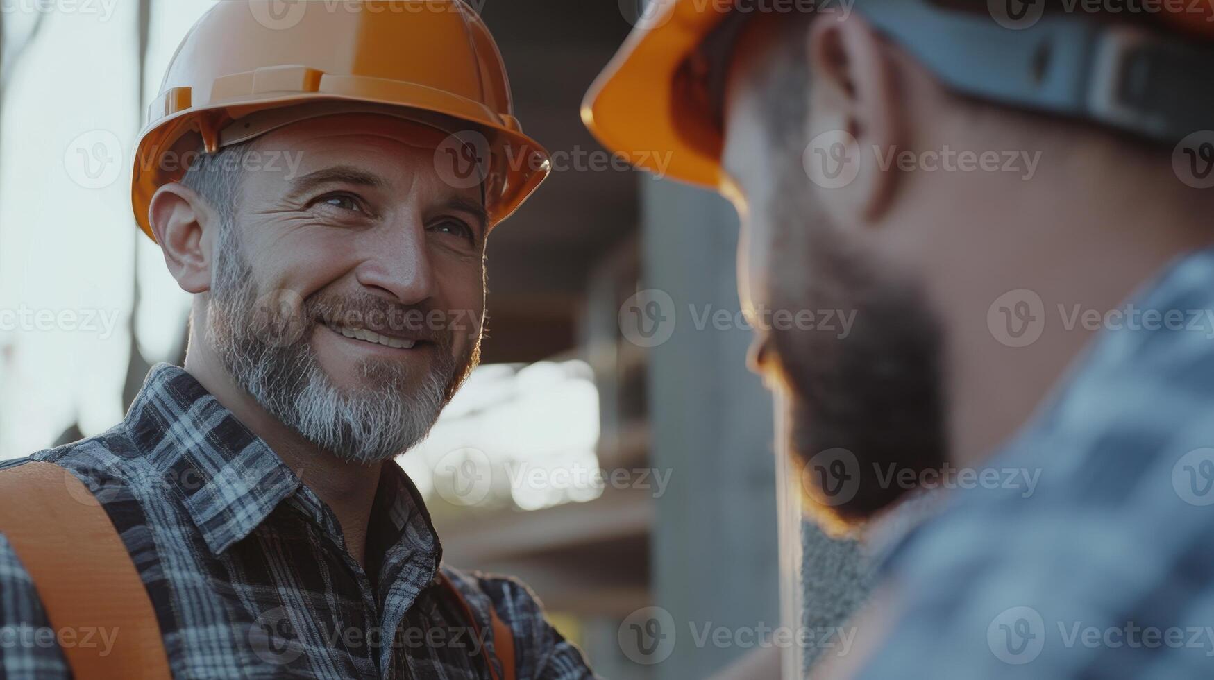 Smiling Construction Workers Engaged in Friendly Conversation at a Job Site During Sunset Hours photo