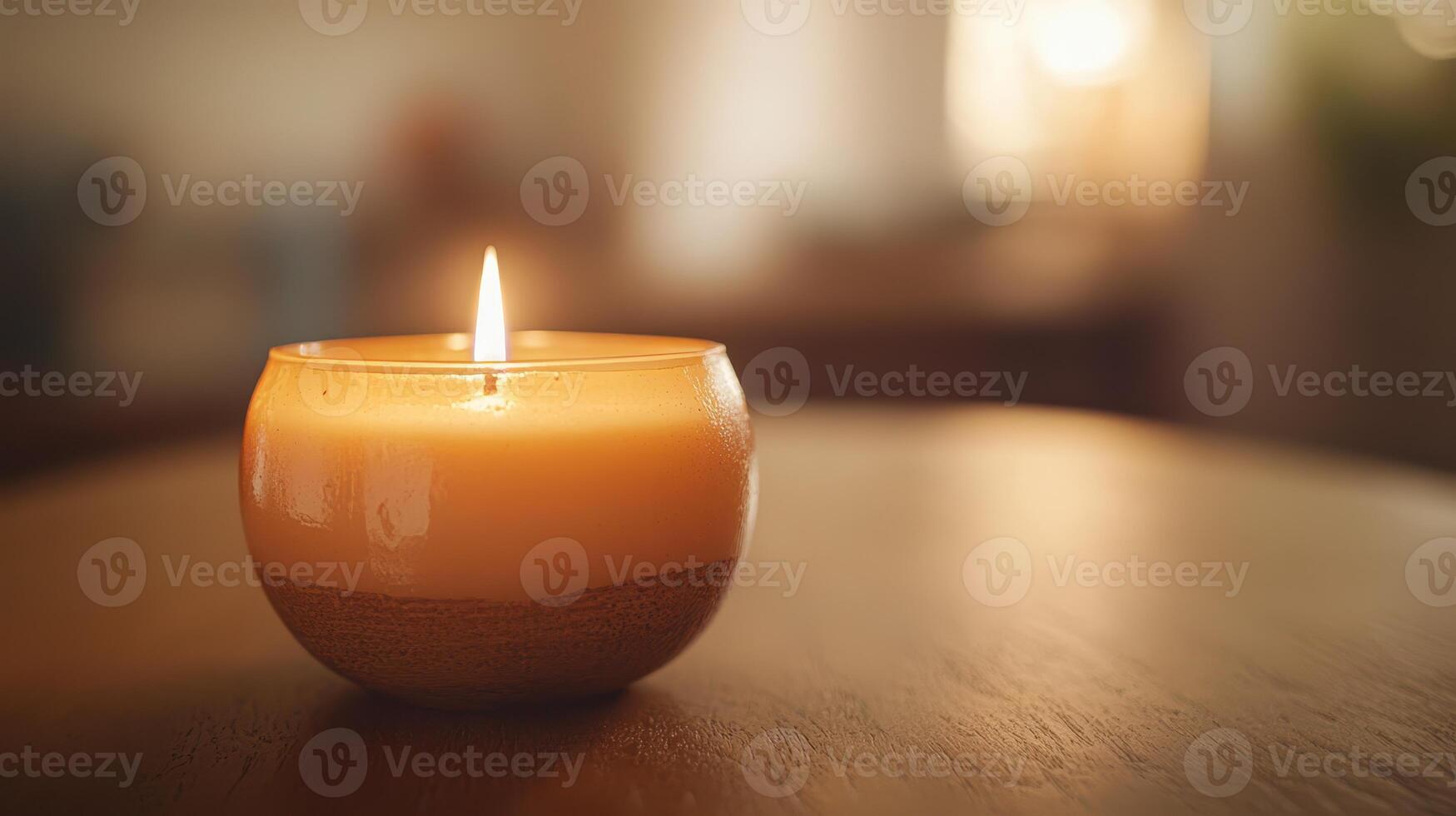 Warm candlelight flickers on a wooden table in a cozy indoor setting during the evening photo