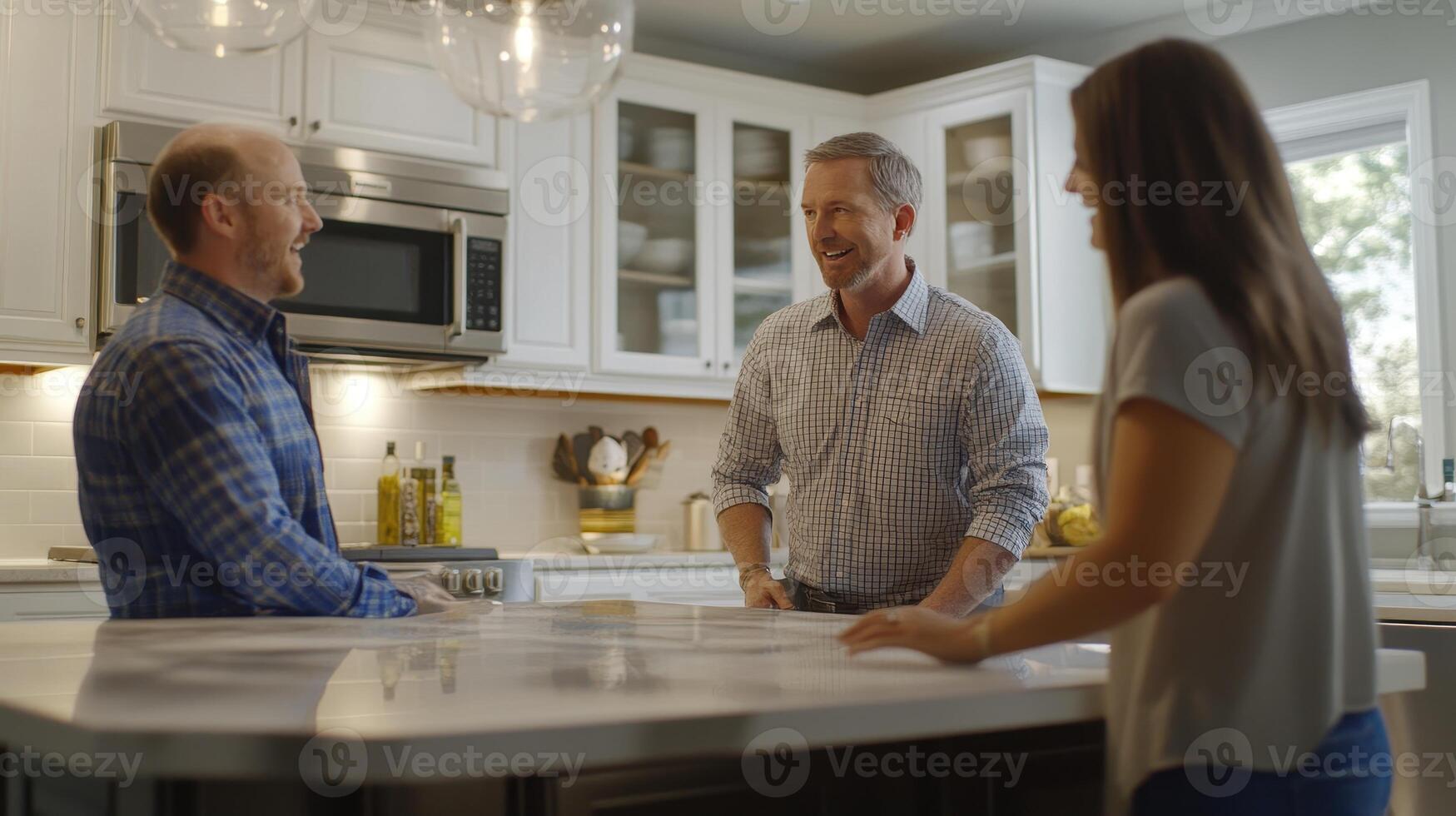 Friends enjoying a casual gathering in a modern kitchen during the afternoon, sharing laughter and conversation while cooking together photo