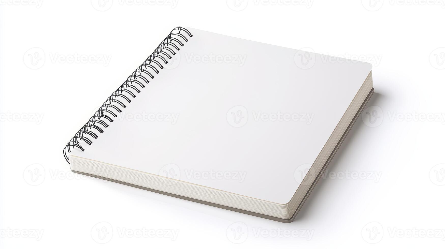 Blank spiral notebook on a white background for creative writing, drawing, or sketching activities photo