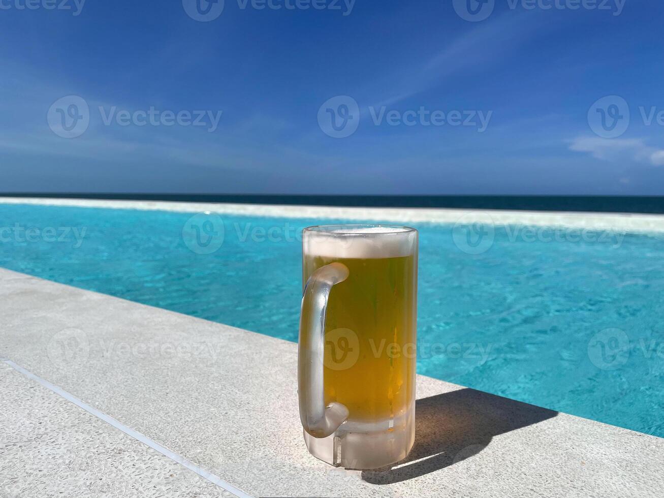 Beer, a Alcohol drink with a sea view. photo