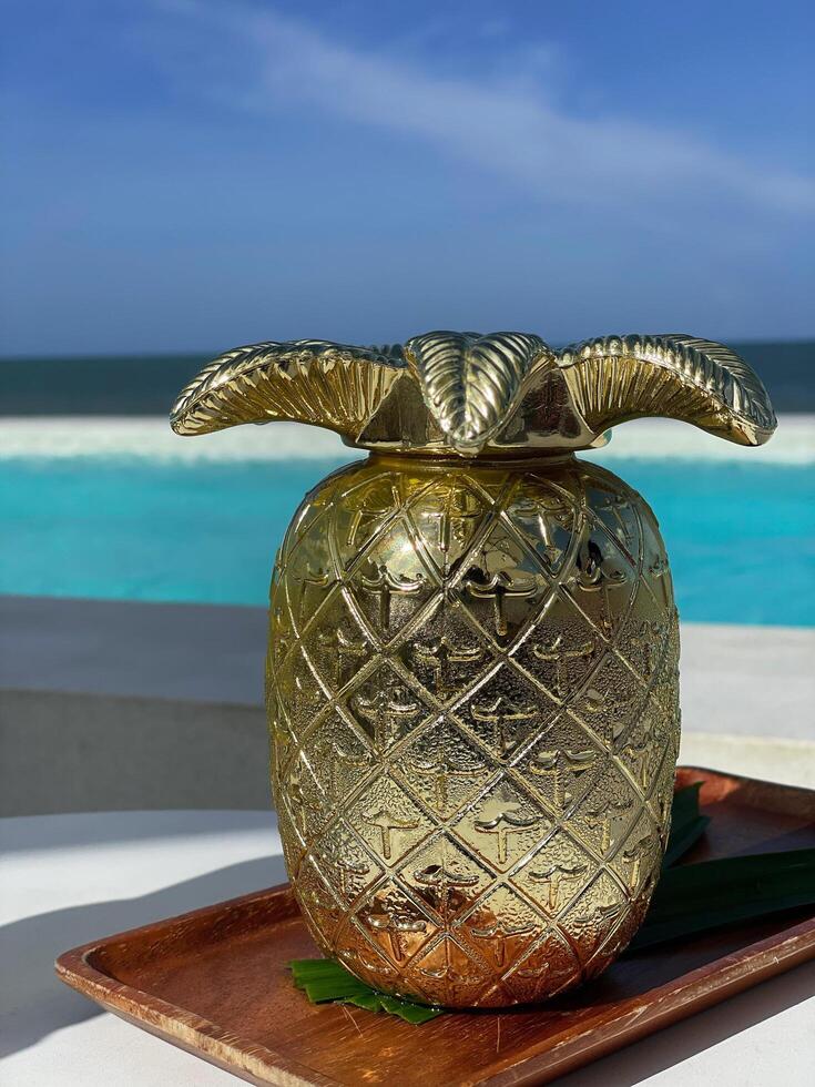 Pineapple juice, a refreshing drink with a sea view. photo