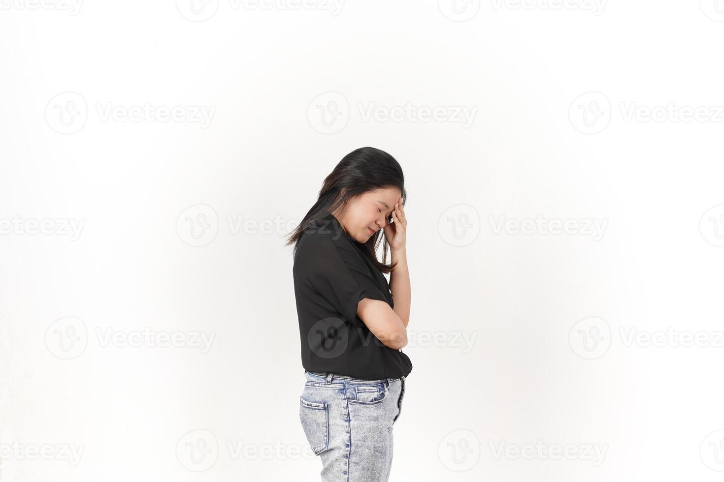 Young Asian woman Suffering Headache wearing Black t-shirt and jeans isolated on white background photo