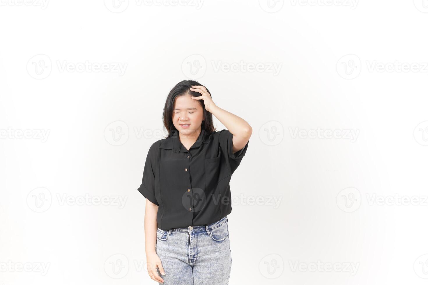 Young Asian woman Suffering Headache wearing Black t-shirt and jeans isolated on white background photo