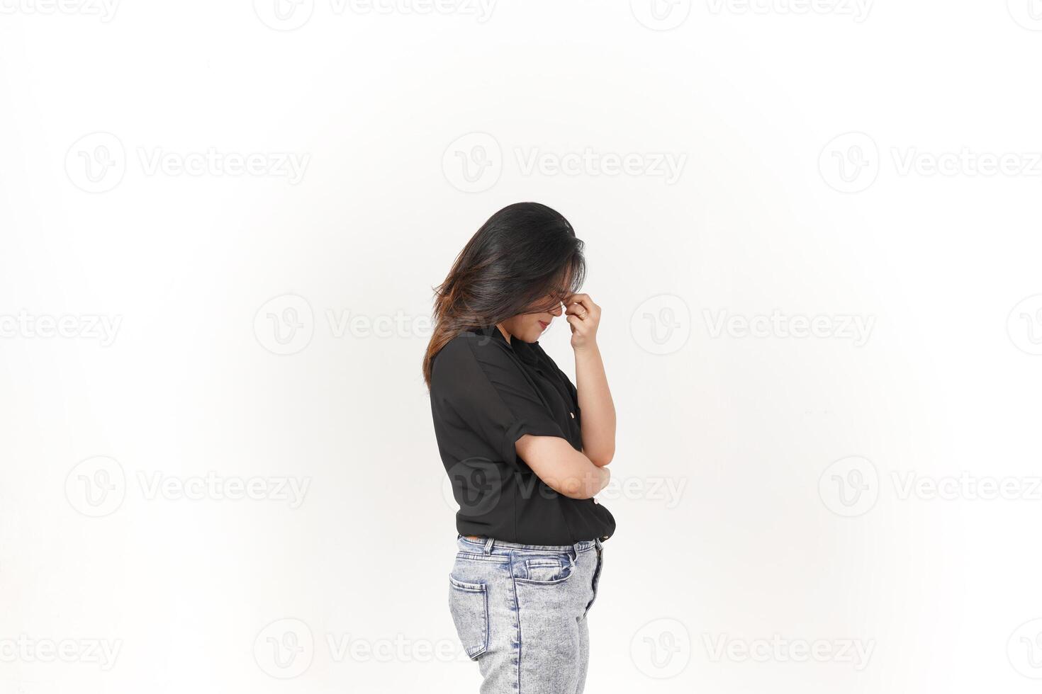 Young Asian woman Suffering Headache wearing Black t-shirt and jeans isolated on white background photo