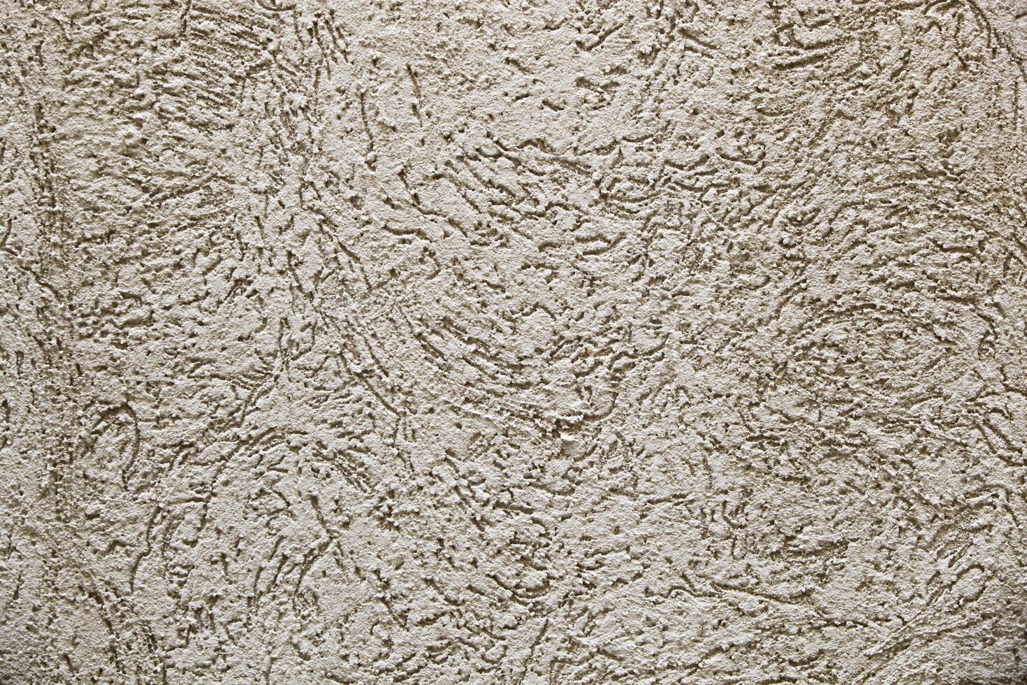 Old wall texture. House exterior finish. Plaster wall with holes. Texture. Background. photo