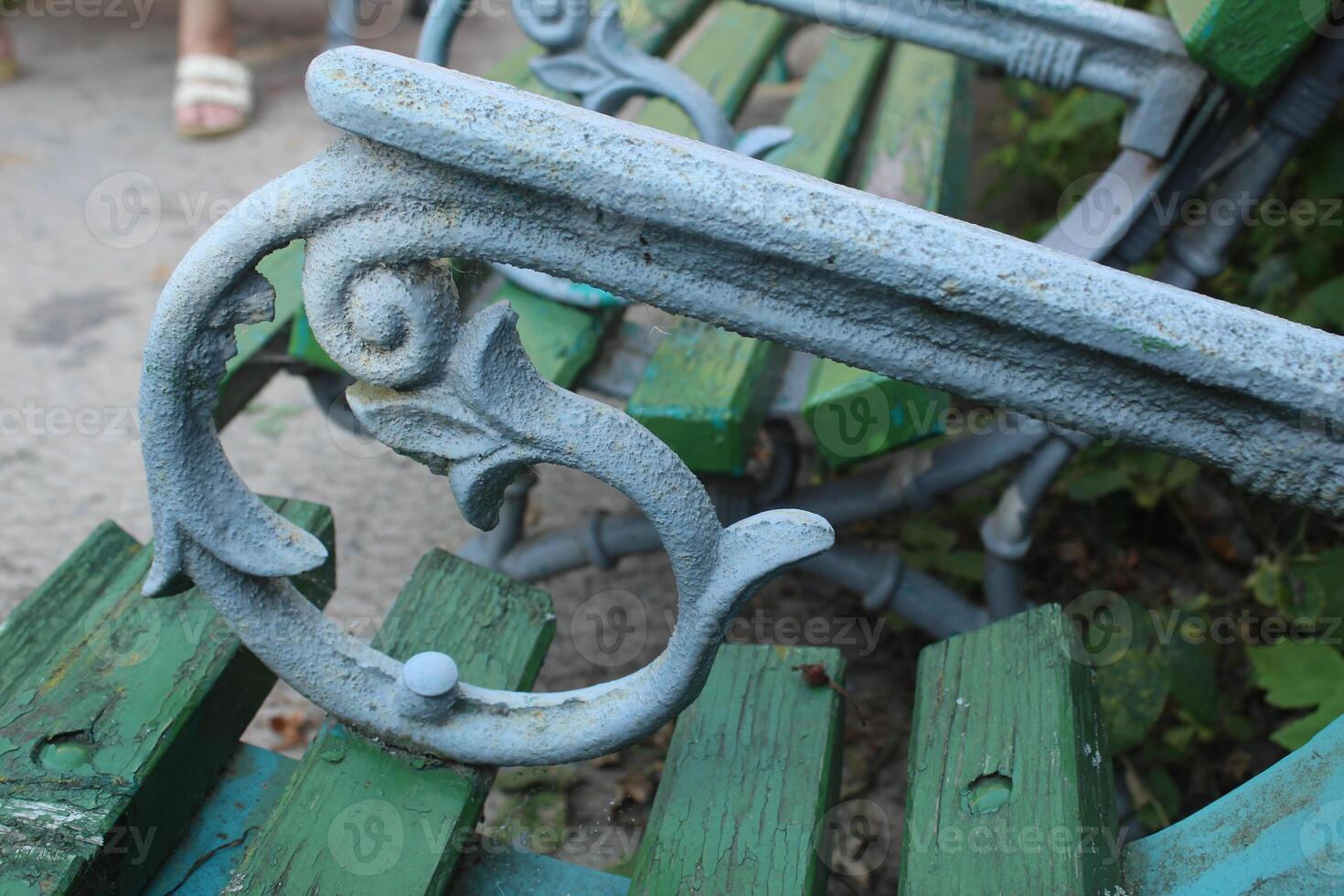 Forged patterns. Metal pattern on bench close-up photo