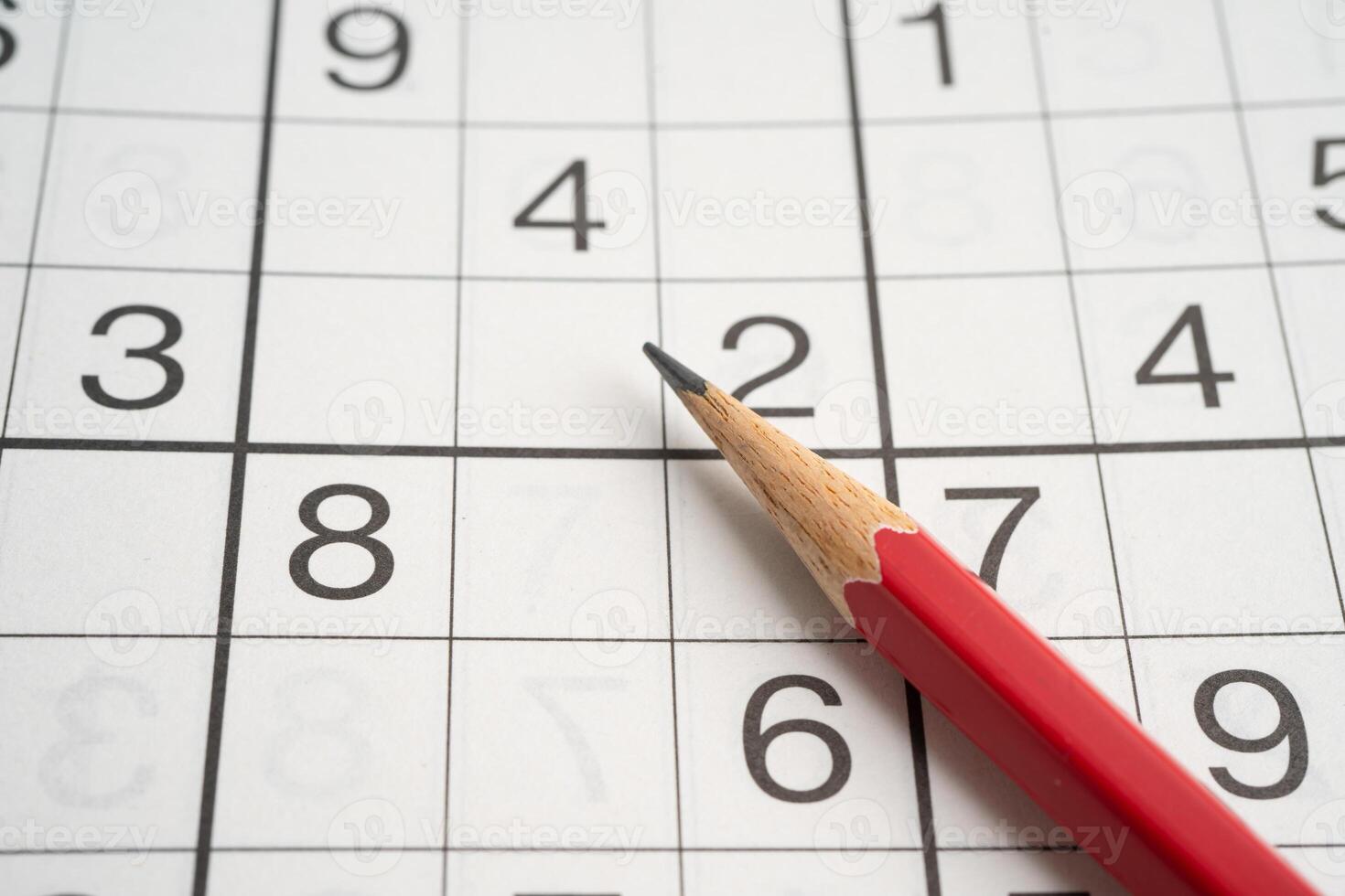 Sudoku puzzle game playing to challenge brain. photo