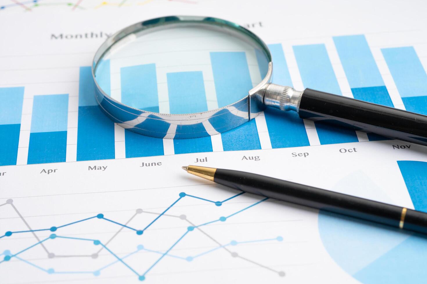 Pen on graph paper. Financial development, Banking Account, Statistic, Investment Analytic research data economy, Business. photo