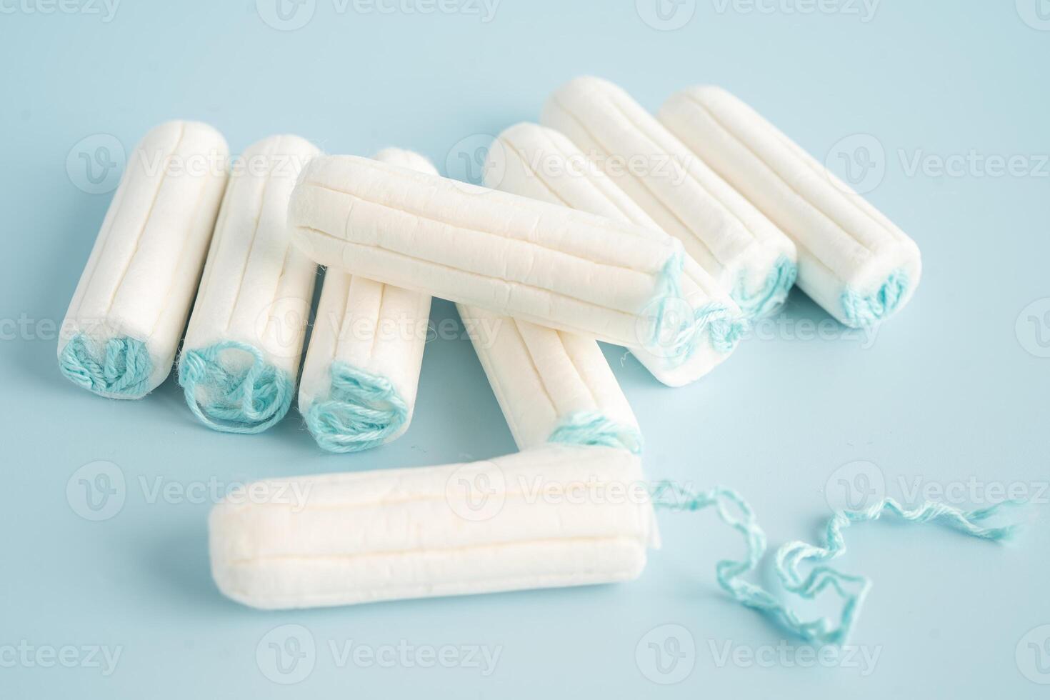 Menstruation cycle with sanitary cotton tampon for woman hygiene and protection. photo