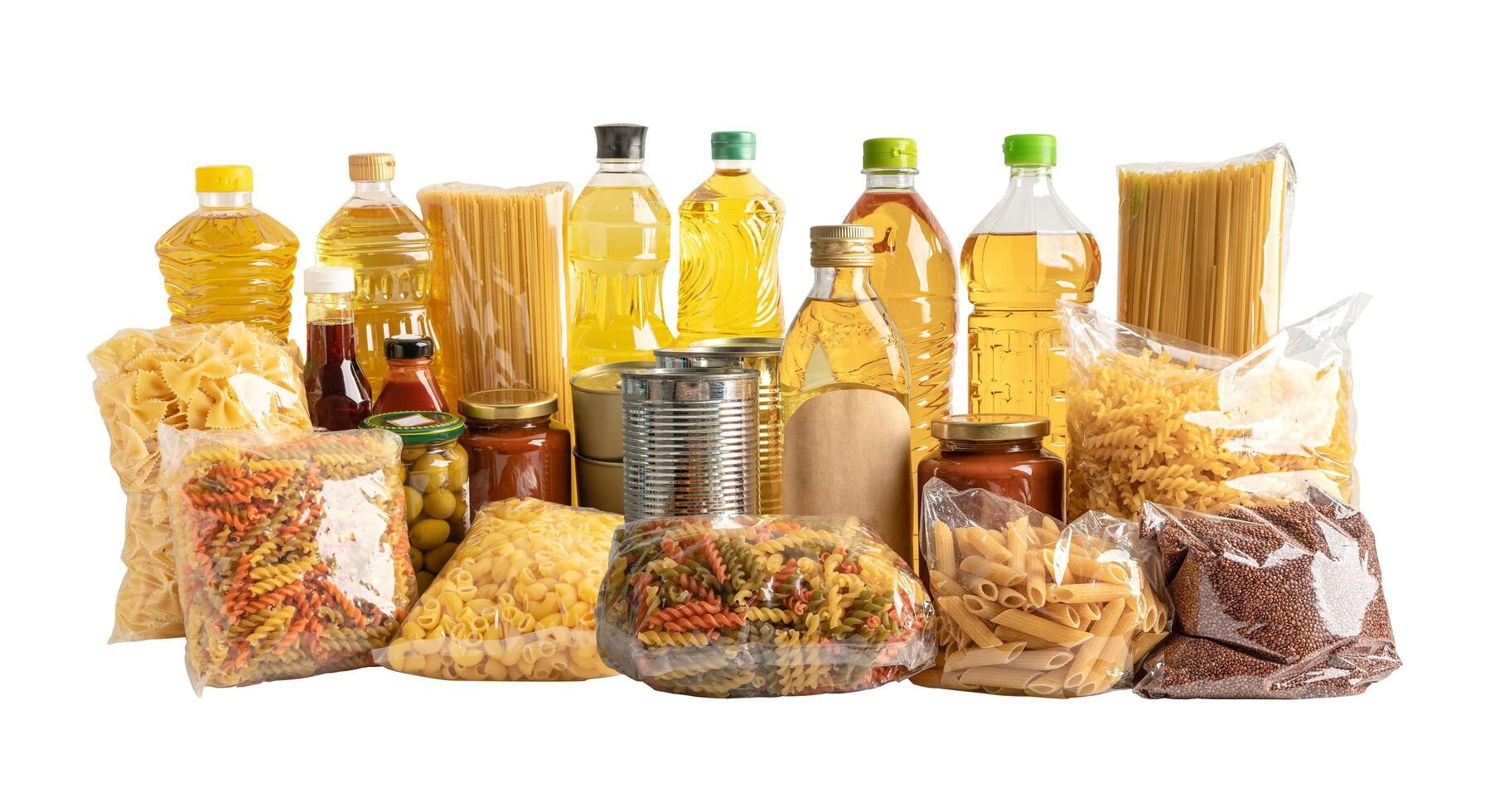 Foodstuff for donation, storage and delivery. Various food, pasta, cooking oil and canned food in cardboard box. photo