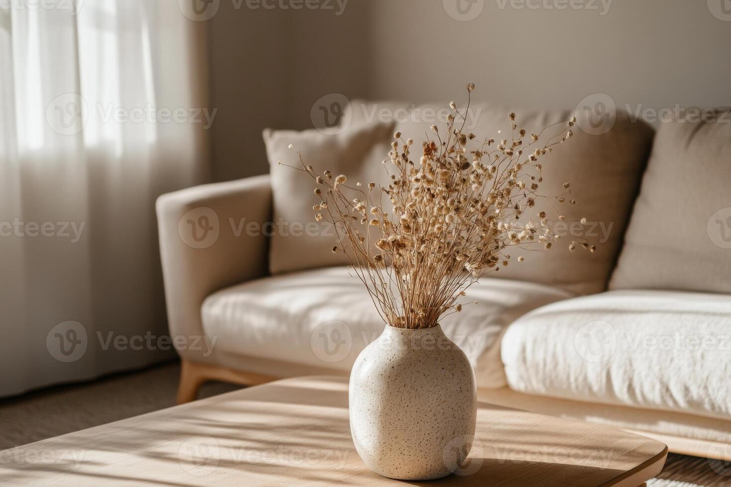 Handmade ceramic vase with dried flowers indoors photo