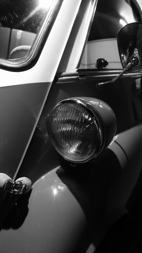Turin, Italy - June 20, 2021. a headlight of an antique car at the Automobile Museum photo