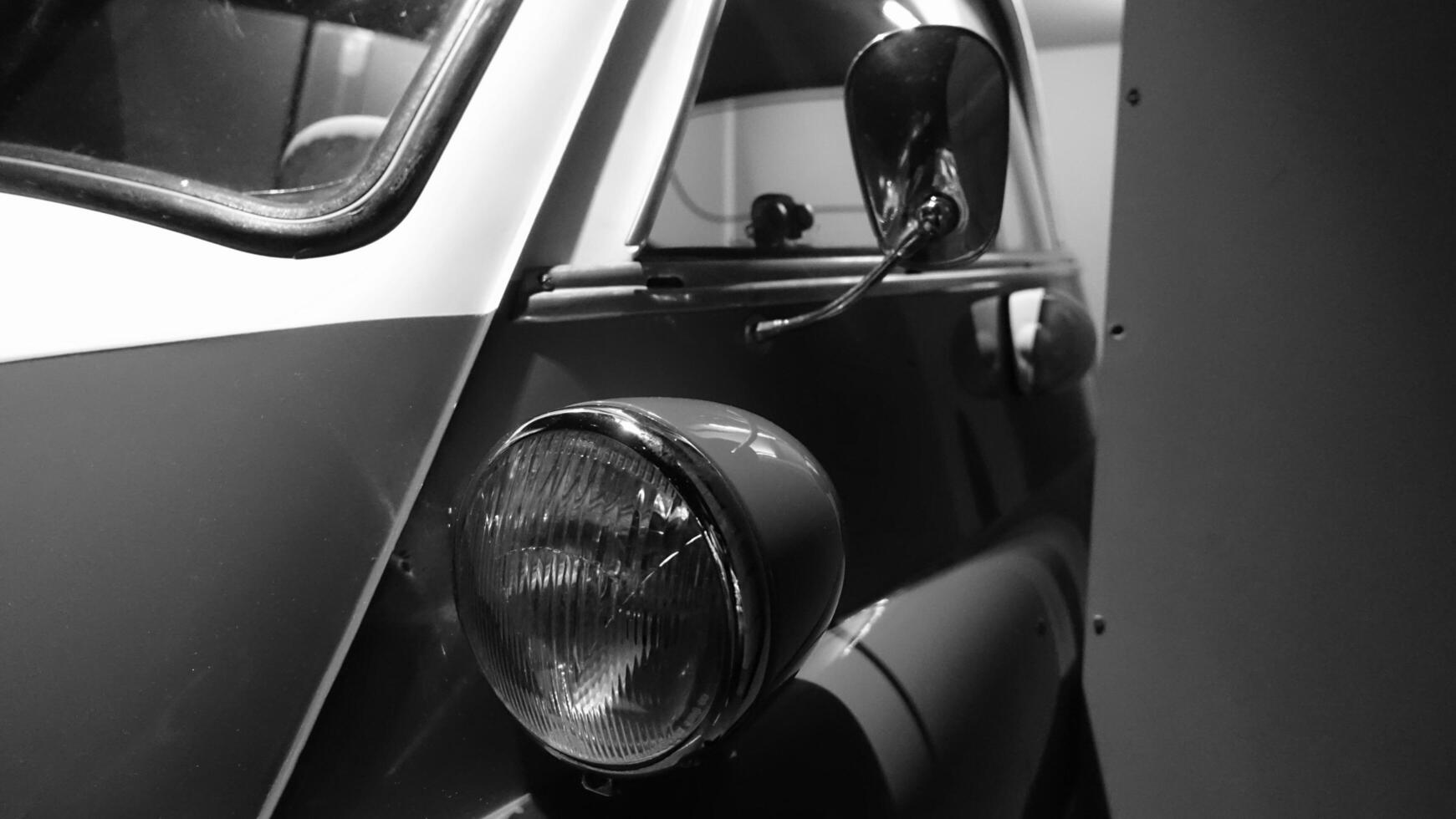 Turin, Italy - June 20, 2021. a headlight of an antique car at the Automobile Museum photo