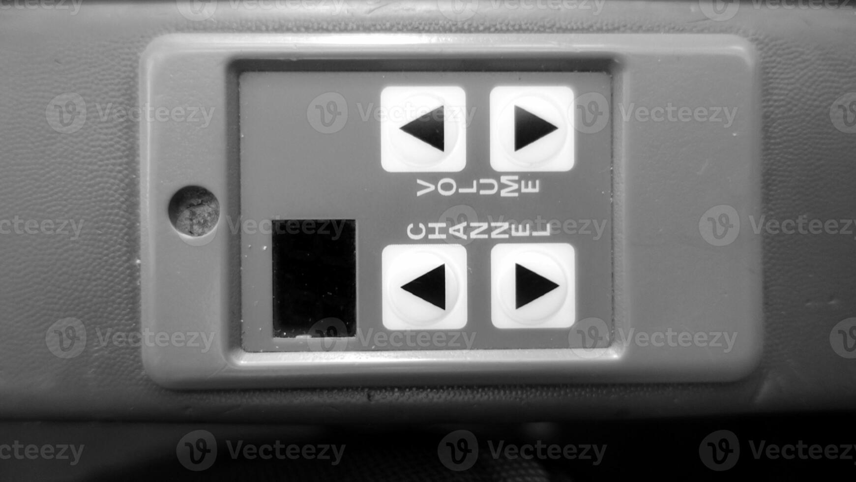 Audio control on an armrest of an airplane chair. photo
