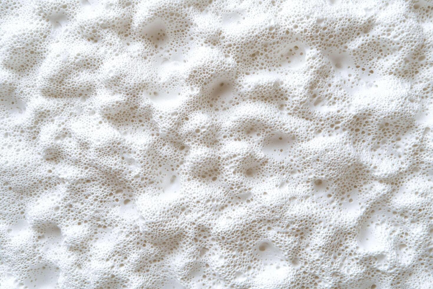 The styrofoam texture background features a pattern of tiny, interconnected foam beads with a subtle grainy surface photo