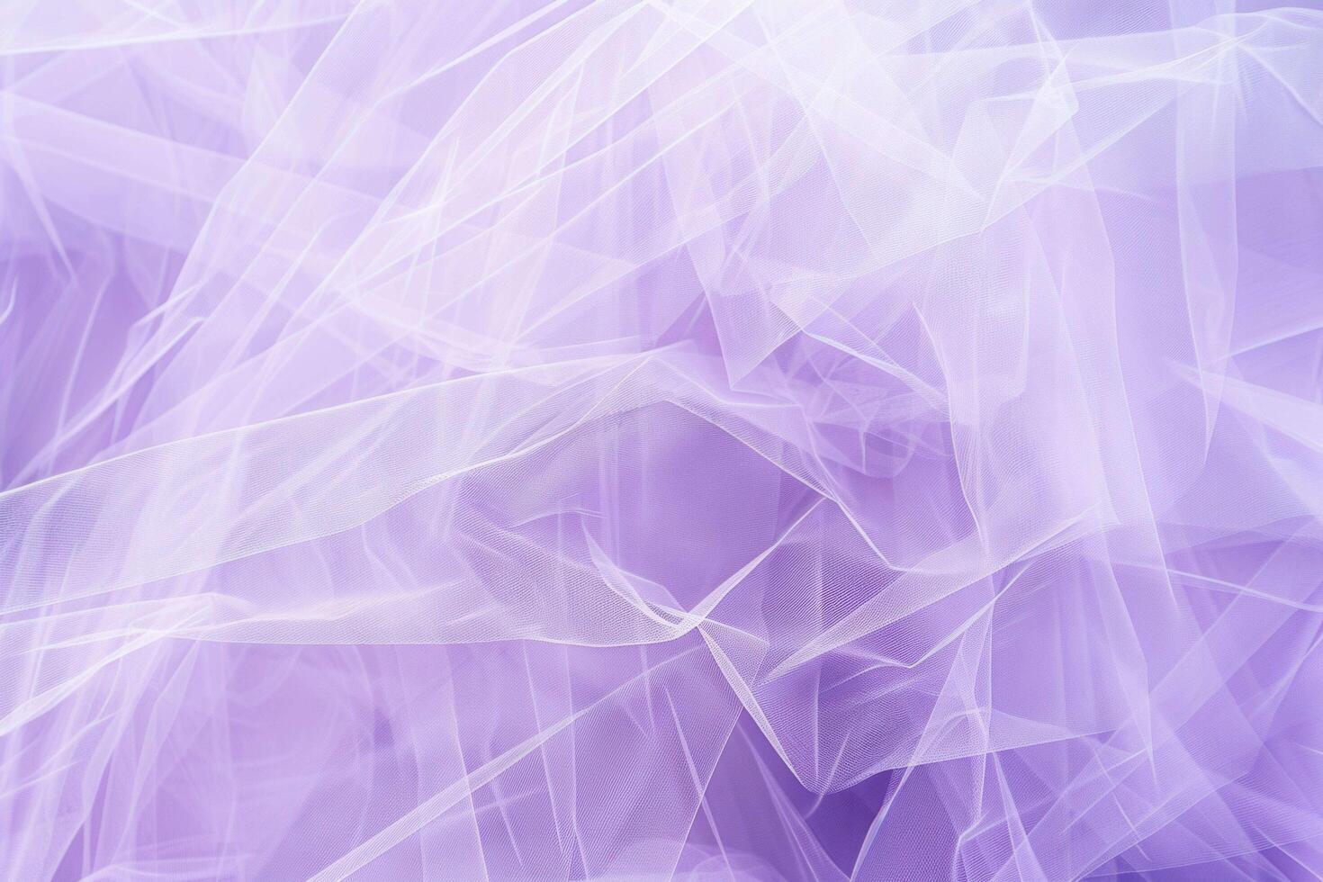 A delicate, sheer tulle texture creates a soft and airy background photo