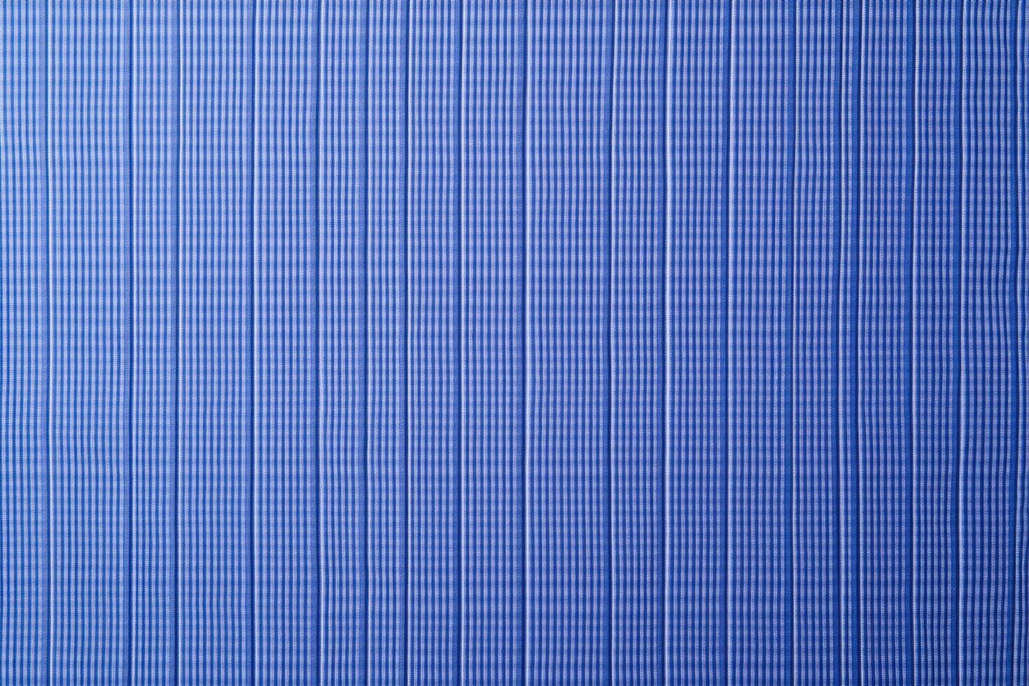 A seersucker texture background features alternating smooth and puckered stripes, creating a crinkled, wavy appearance photo