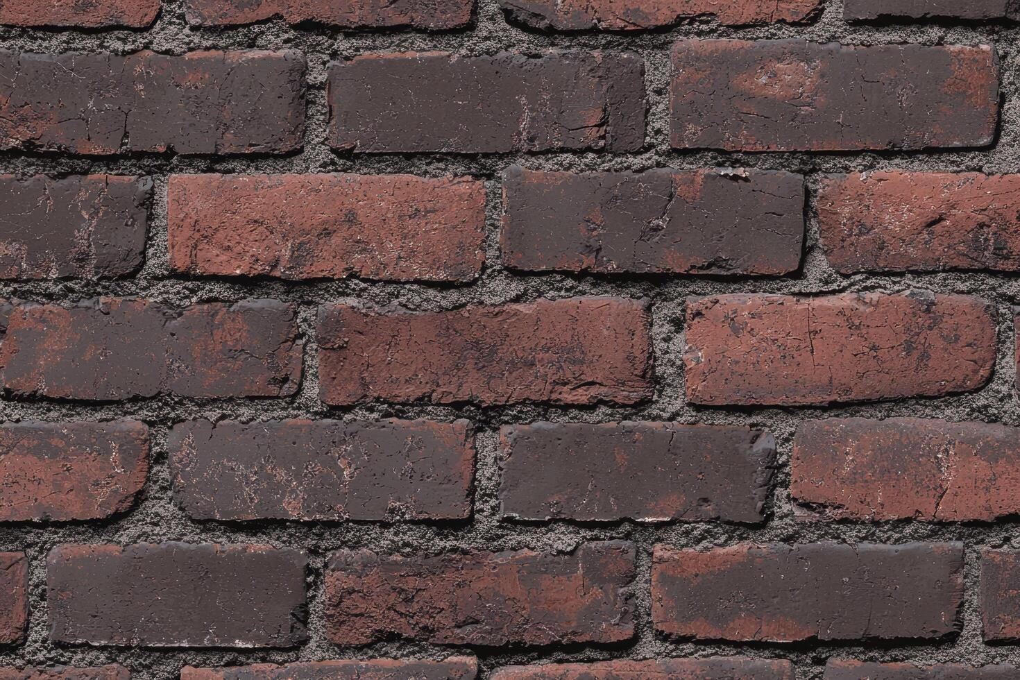 A brick texture background features the rugged, uneven surface of classic red or brown bricks photo