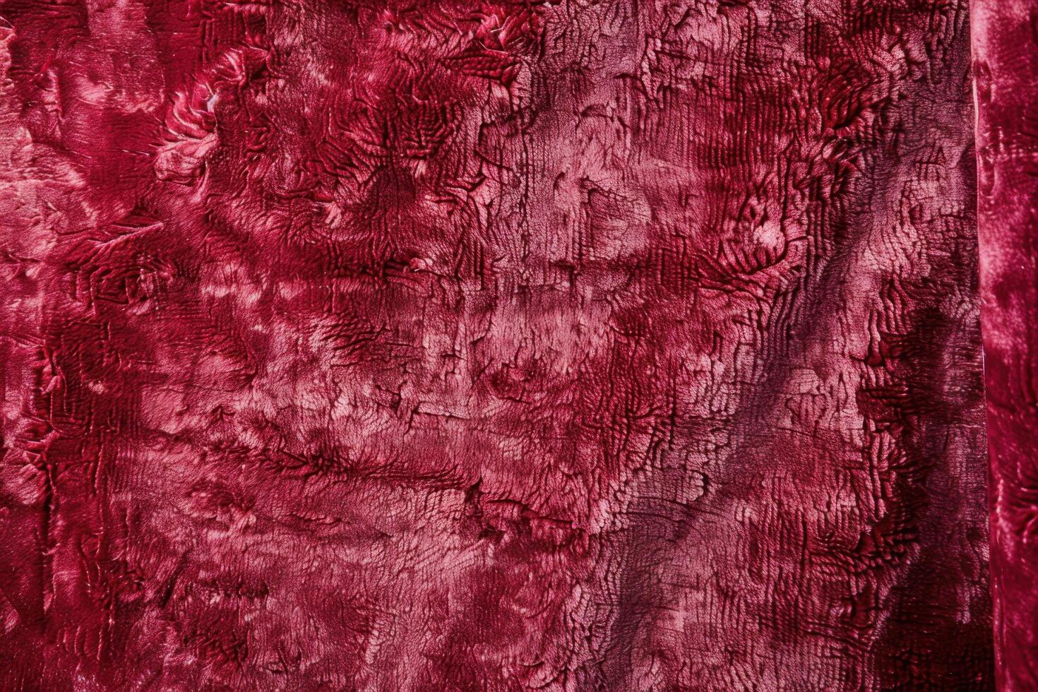 A luxurious deep red velvet texture with a rich, plush surface photo
